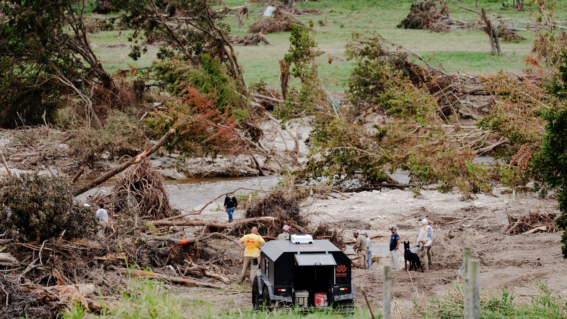  A search group finds a victim from the Texas flood by the Guadalupe River on July 18, 2025 in Center Point, Texas. 