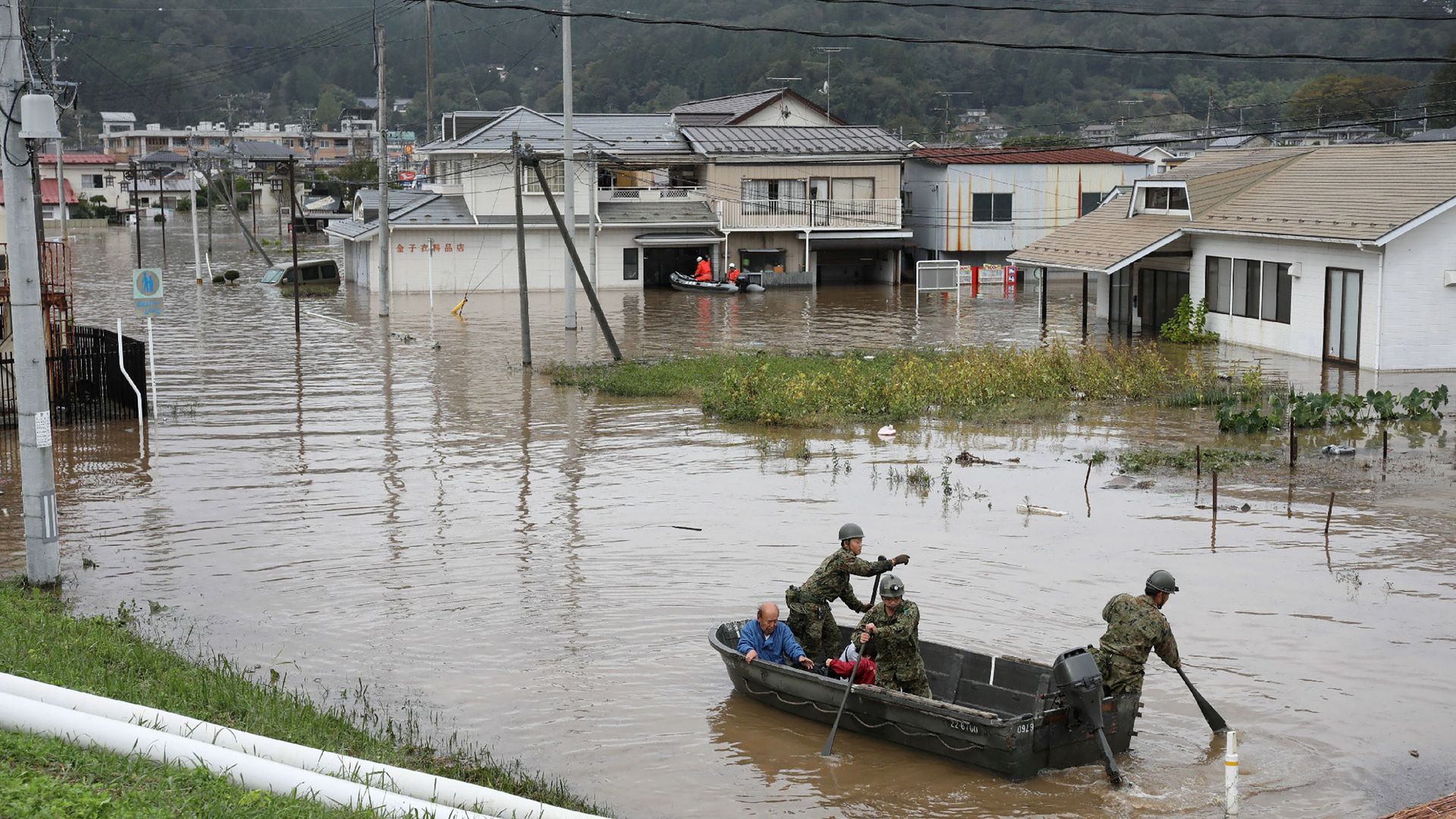 Japan Self-Defense Forces evacuate residents from a flooded area during search and rescue operations in the aftermath of Typhoon Hagibis in Marumori, Miyagi prefecture on October 14, 2019