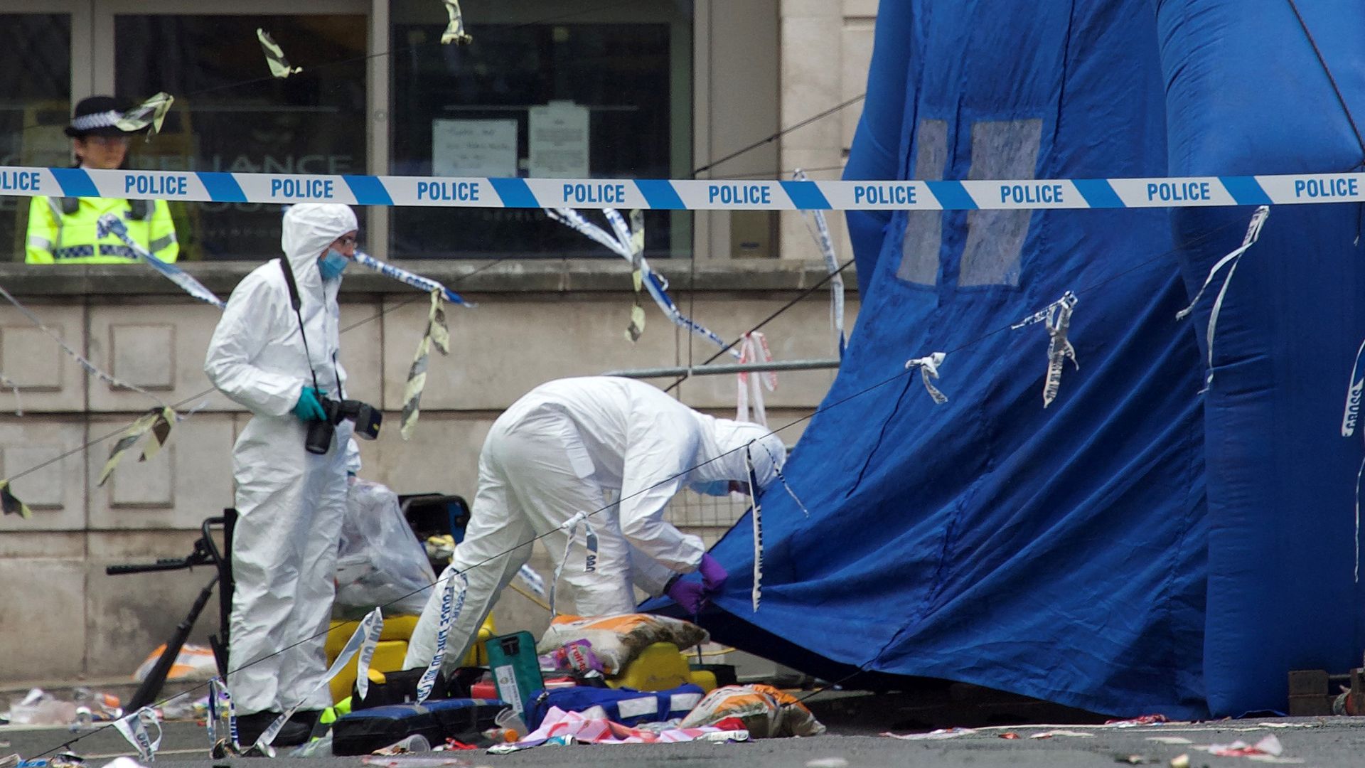 Police forensics officers work at the scene on Water Street in Liverpool, north-west England on May 27, 2025, where a car ploughed in to crowds that had gathered on May 26 to watch an open-top bus victory parade for Liverpool's Premier League trophy parade.