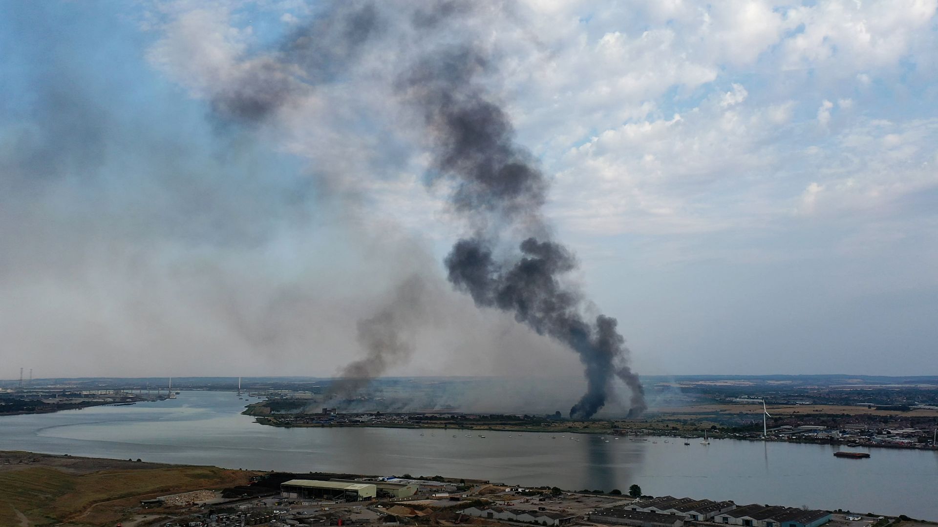 Smoke columns rise from Dartford, Kent on July 19, 2022.