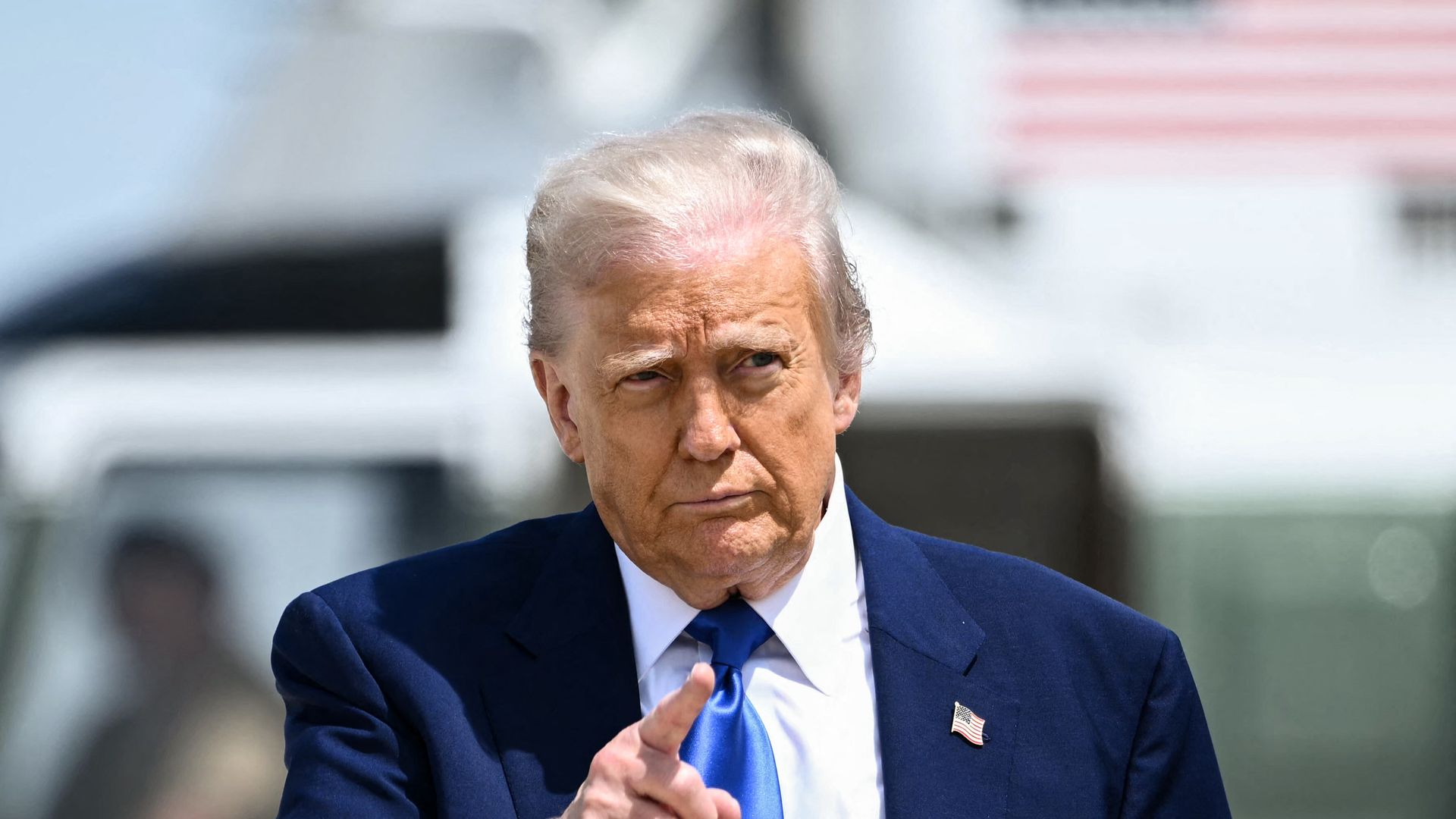President Trump gestures as he walks toward Air Force One.