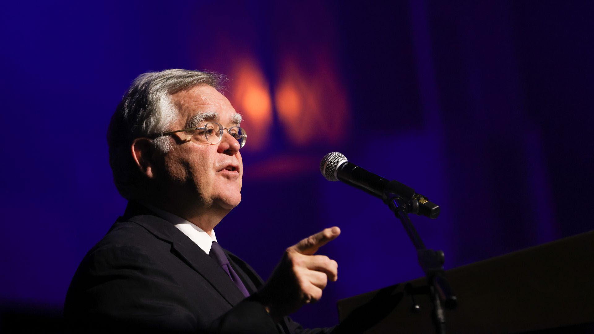 Mayor John Cooper speaks at a podium.