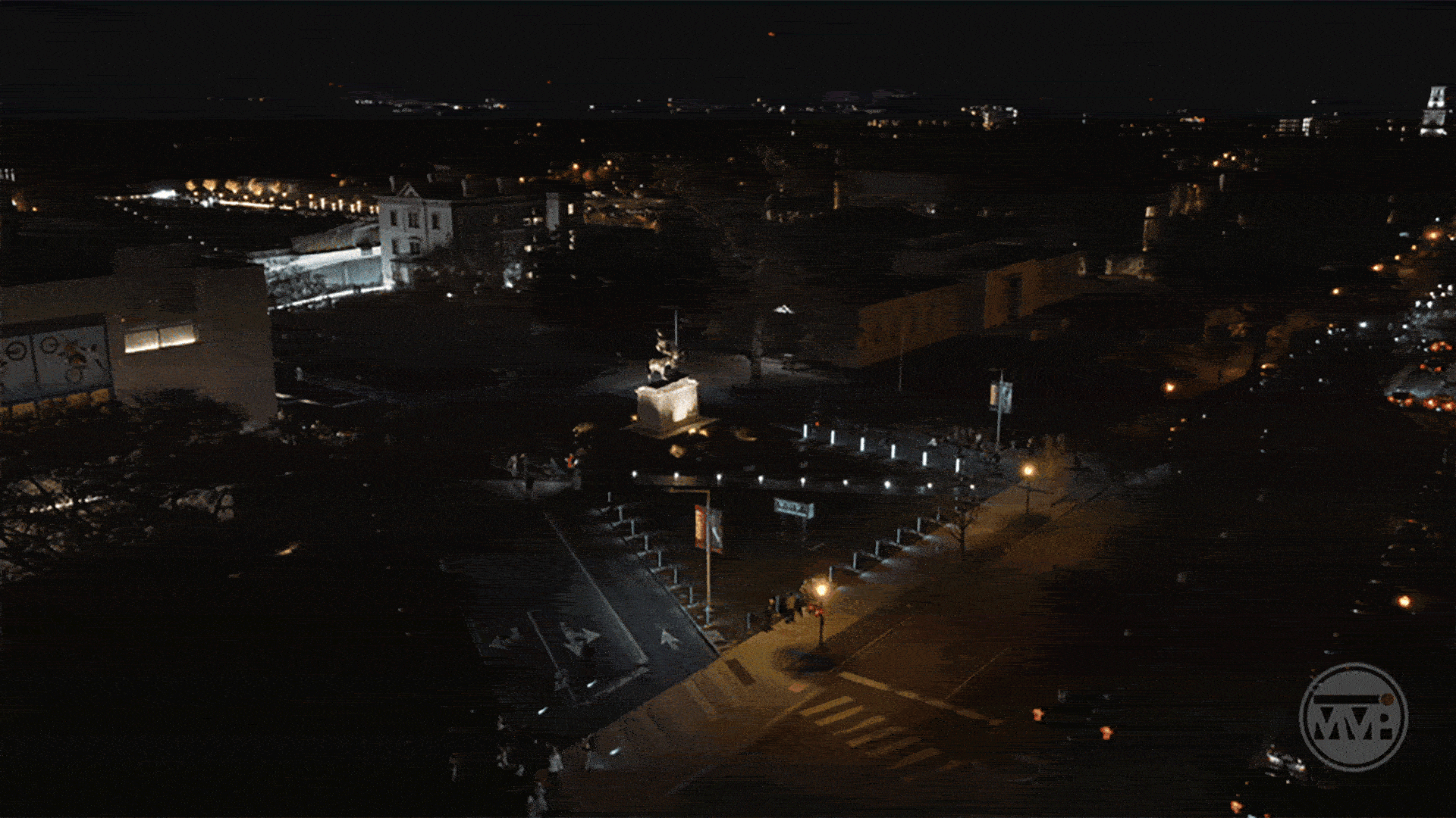 A video showing bikers going down Arthur Ashe Boulevard toward the VMFA before flashing to a shot of them around Alicia Keys and Swizz Beatz, who are standing.