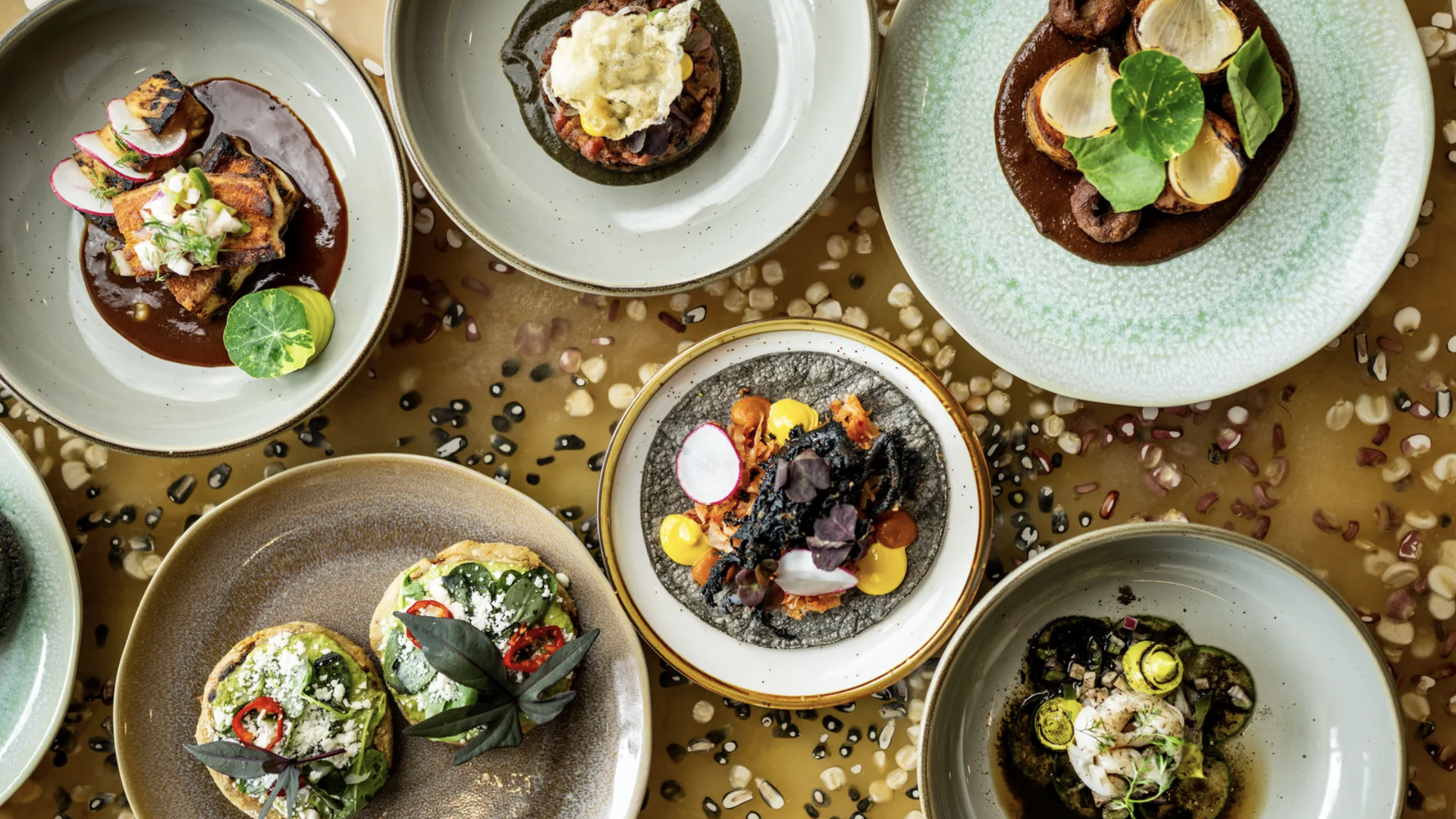 tacos and food on mole on plates