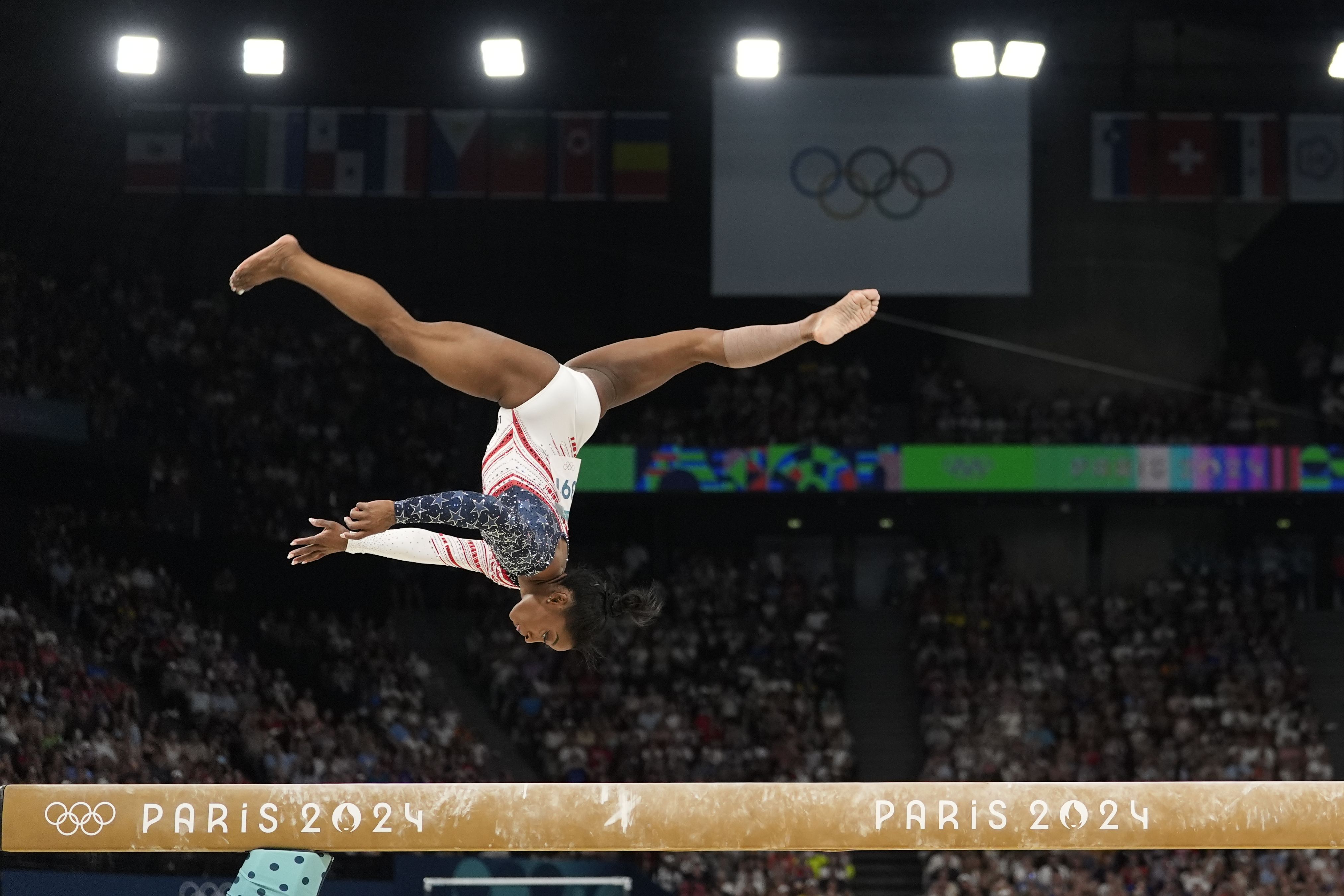 Simone Biles — pictured mid-flight during her beam routine.