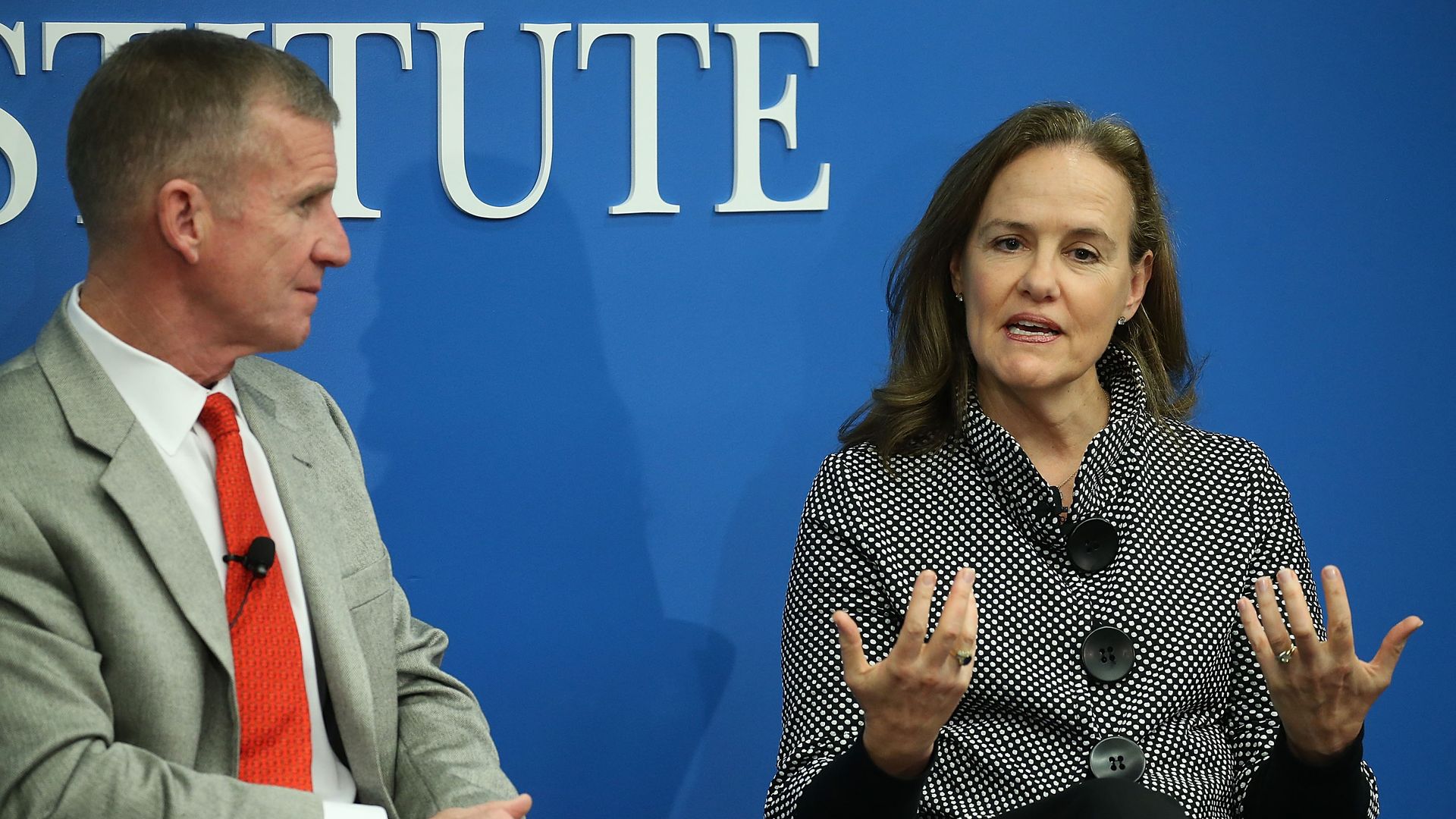 Michele Flournoy speaks as retired Army General Stanley McChrystal looks on.