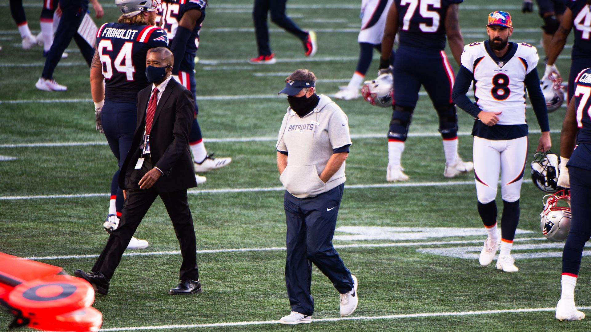 Bill Belichick walks off the field