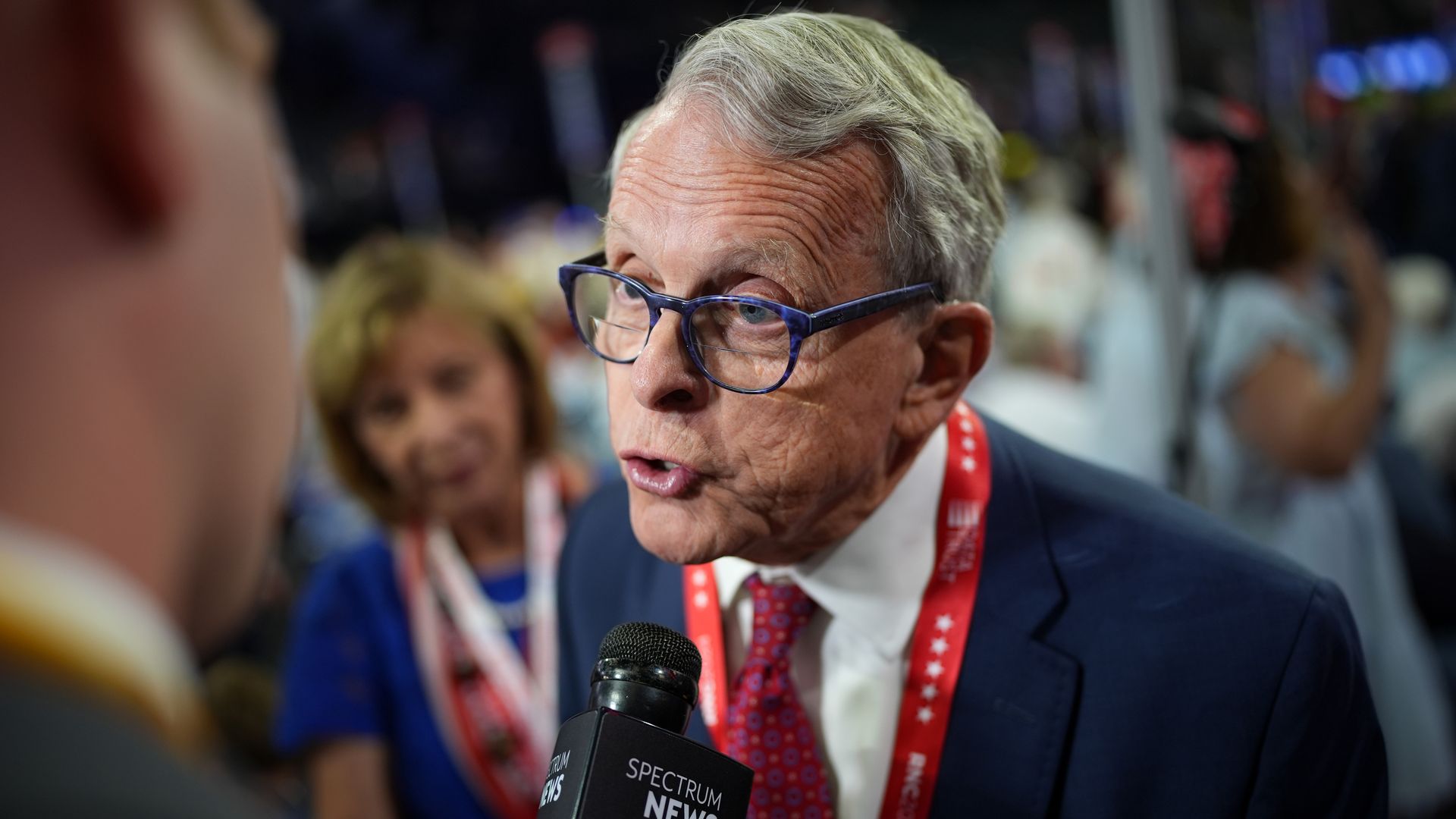 A close-up photo of Gov. Mike DeWine speaking to a reporter at the Republican National Convention