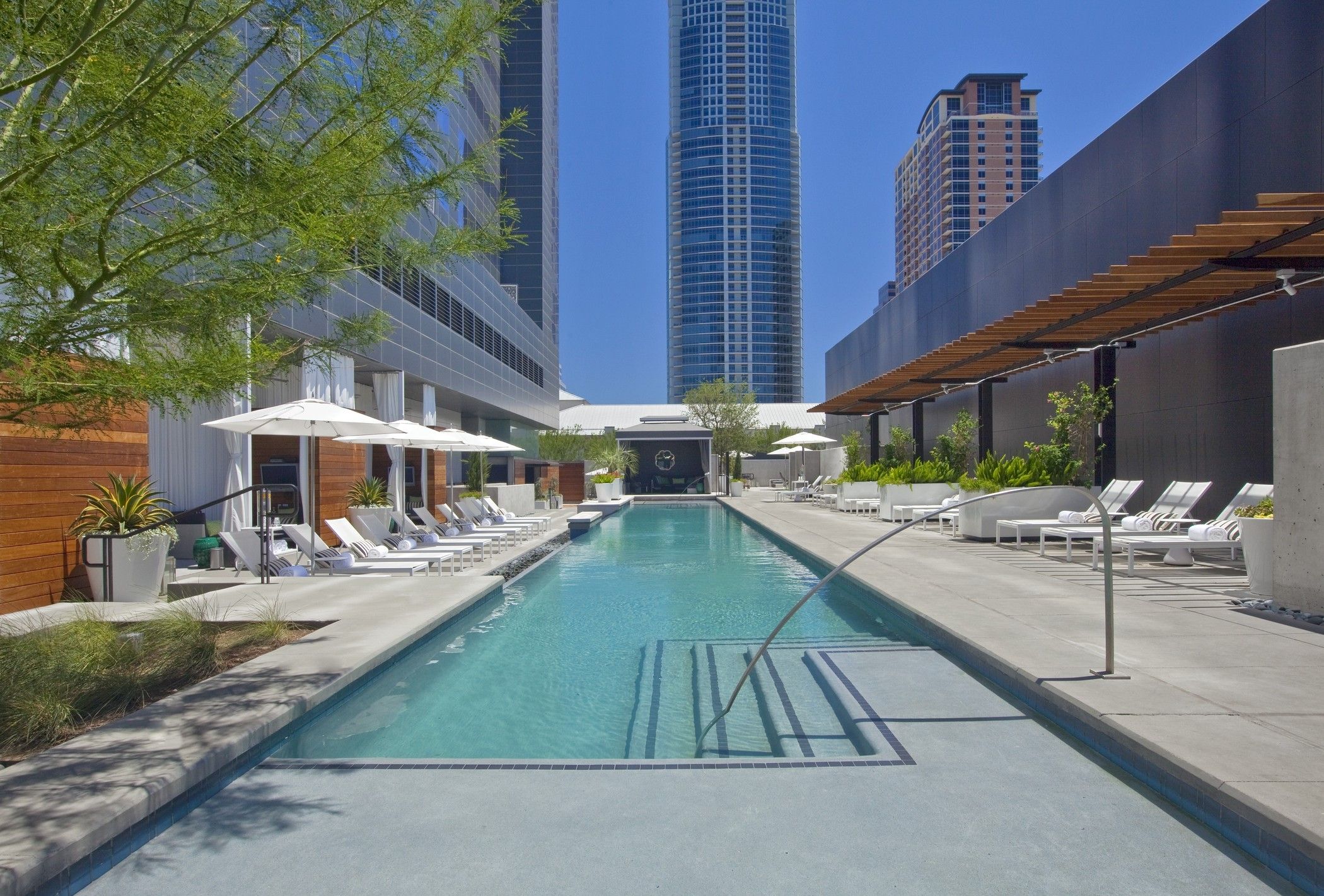 A photo of a pool with seating.
