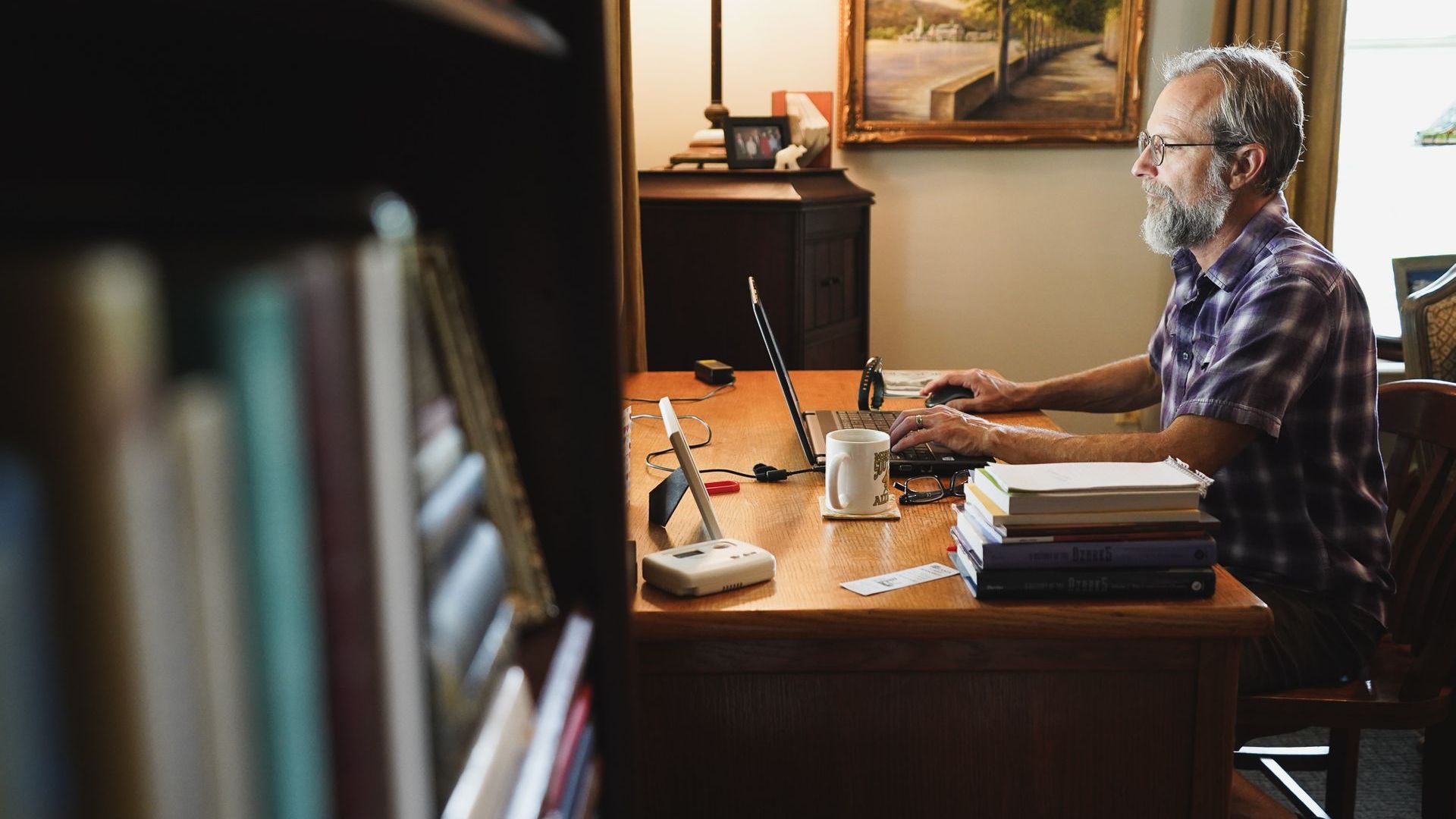 Fayetteville author Matt McGowan at his desk. Photo: Samantha Bertoncino