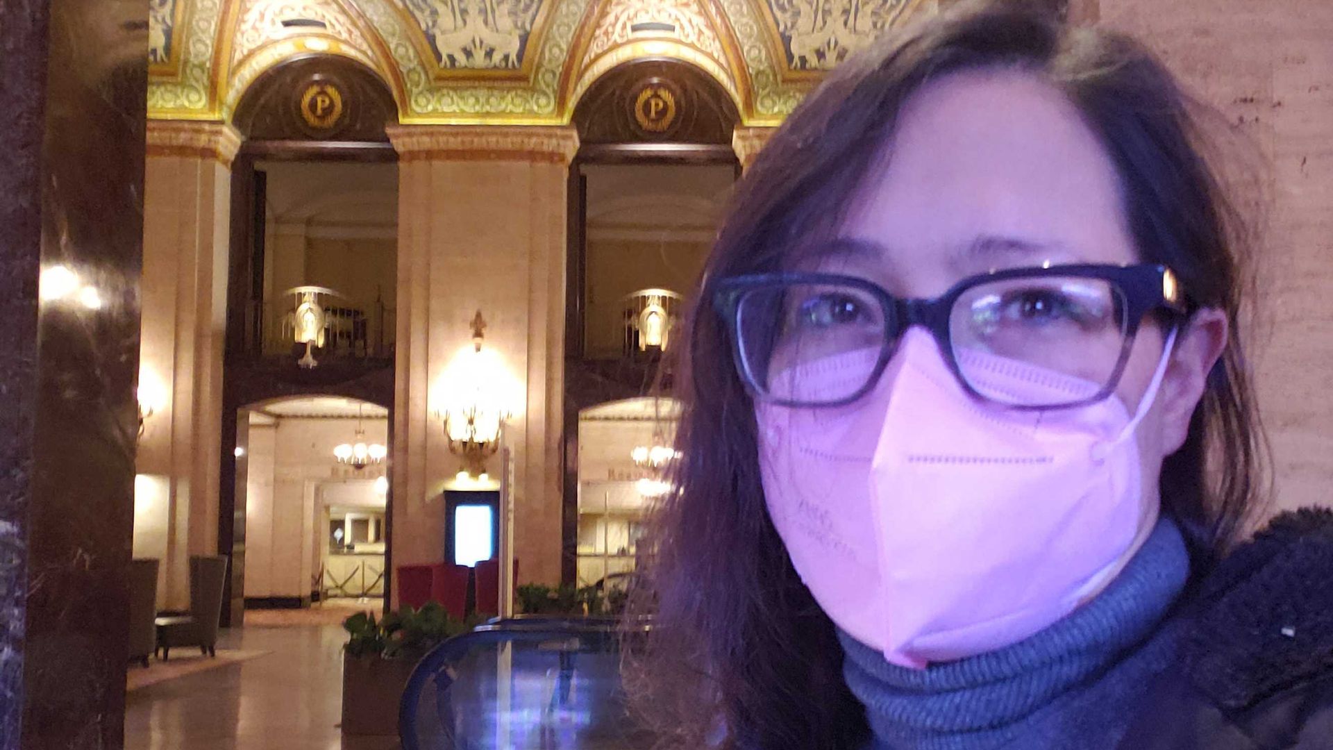 Photo of a woman in a hotel lobby. 