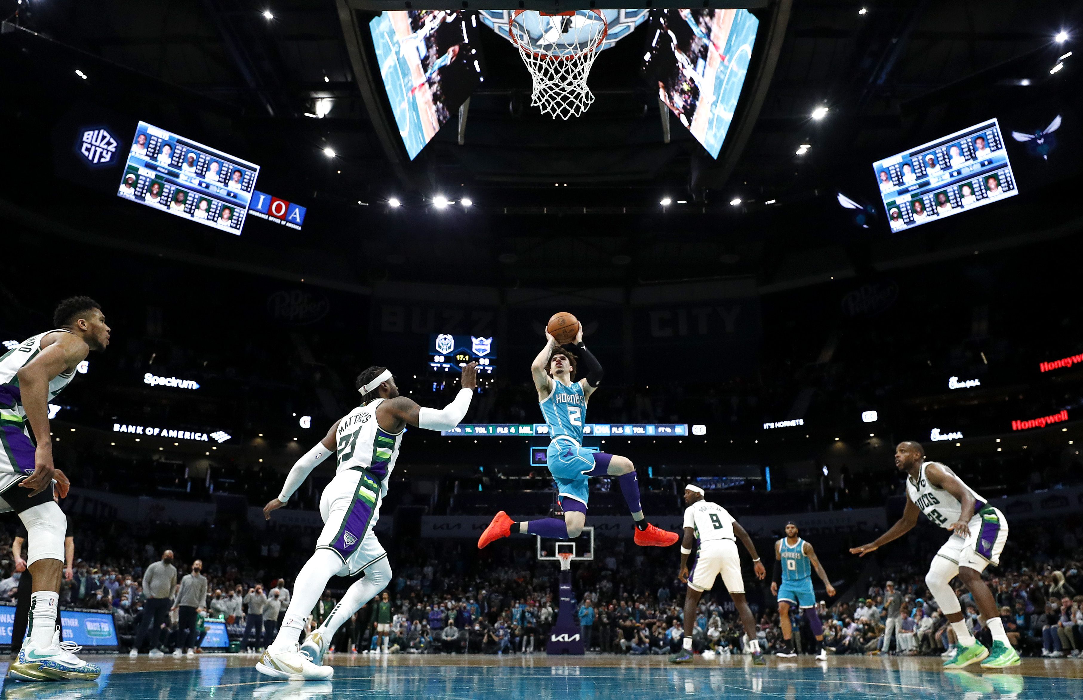 lamelo ball jumping to throw ball