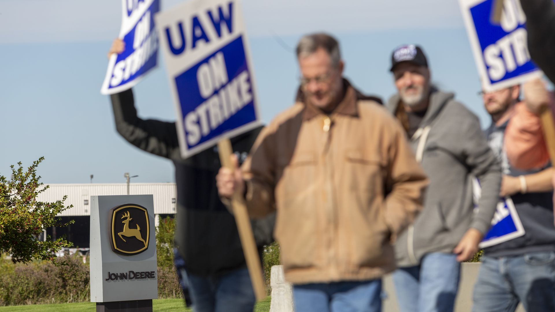 Workers strike outside the John Deere Des Moines Works facility in Ankeny, Iowa on Friday. 