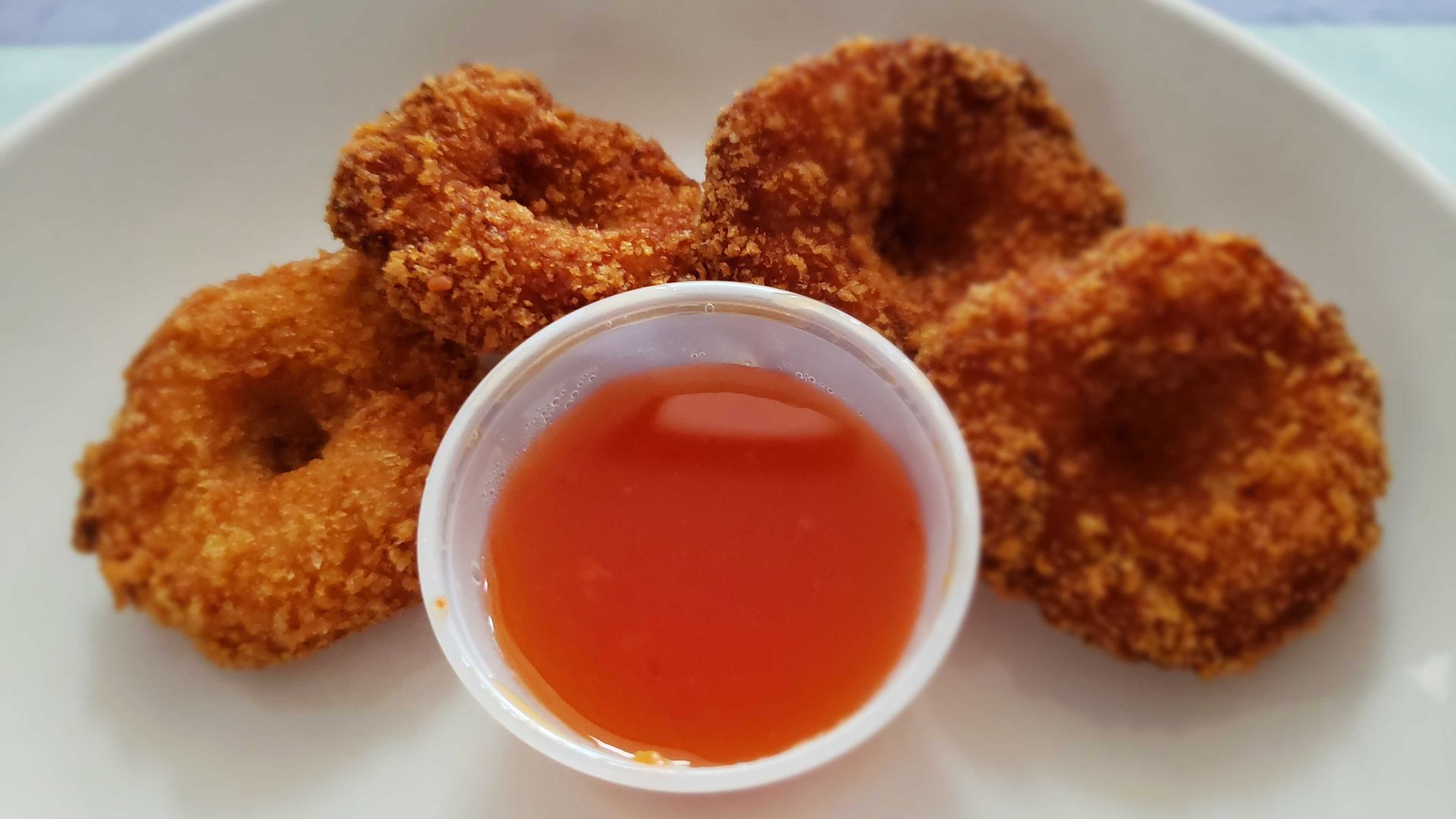 shrimp donuts on a plate.