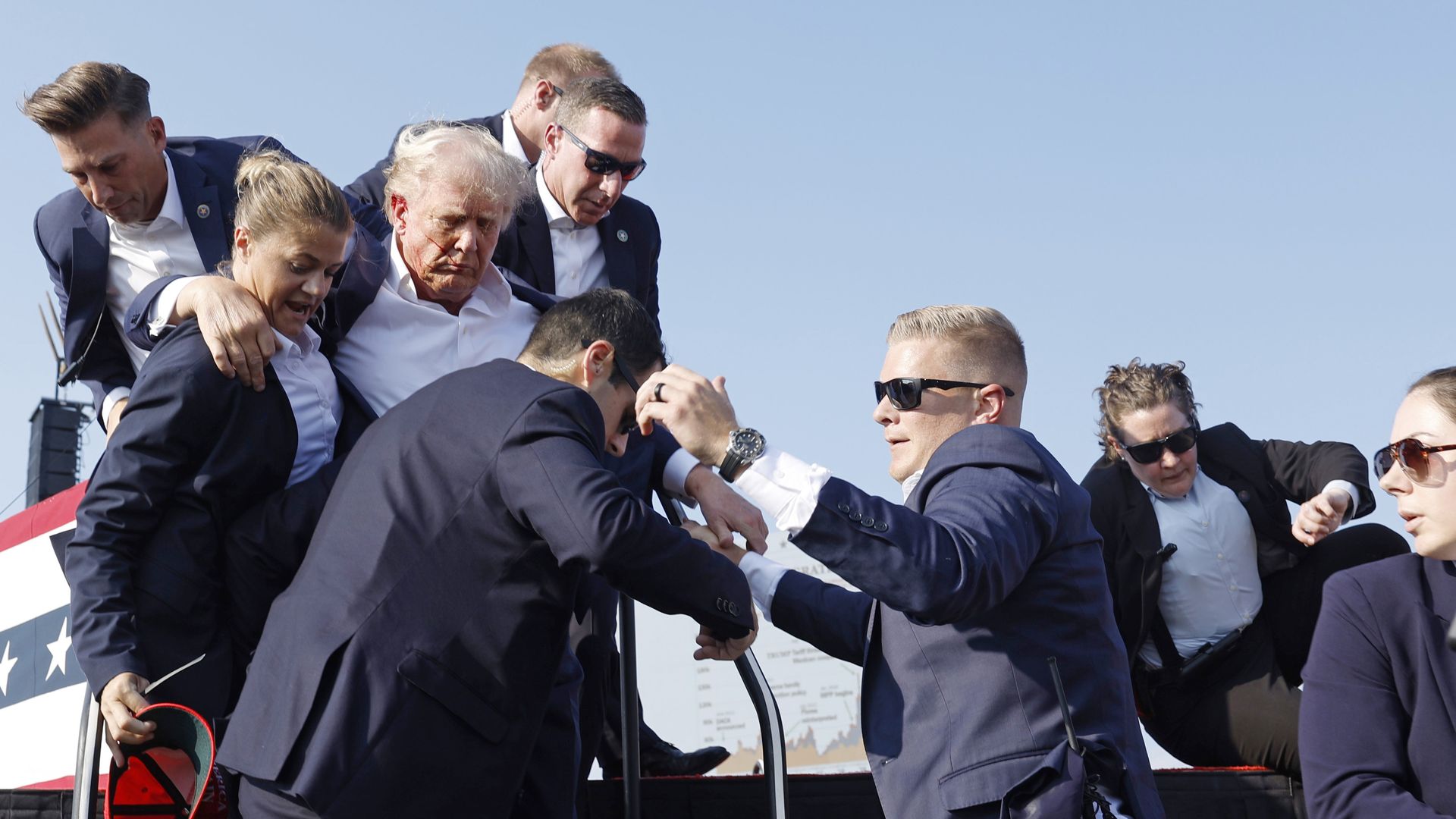 Donald Trump is rushed offstage during a rally on July 13, 2024 in Butler, Pennsylvania