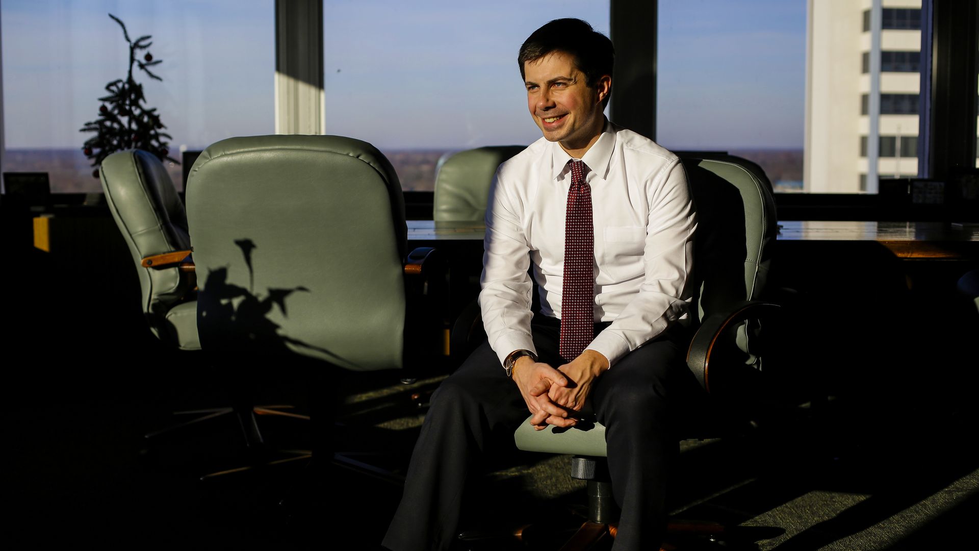 Peter Buttigieg sitting in an office chair