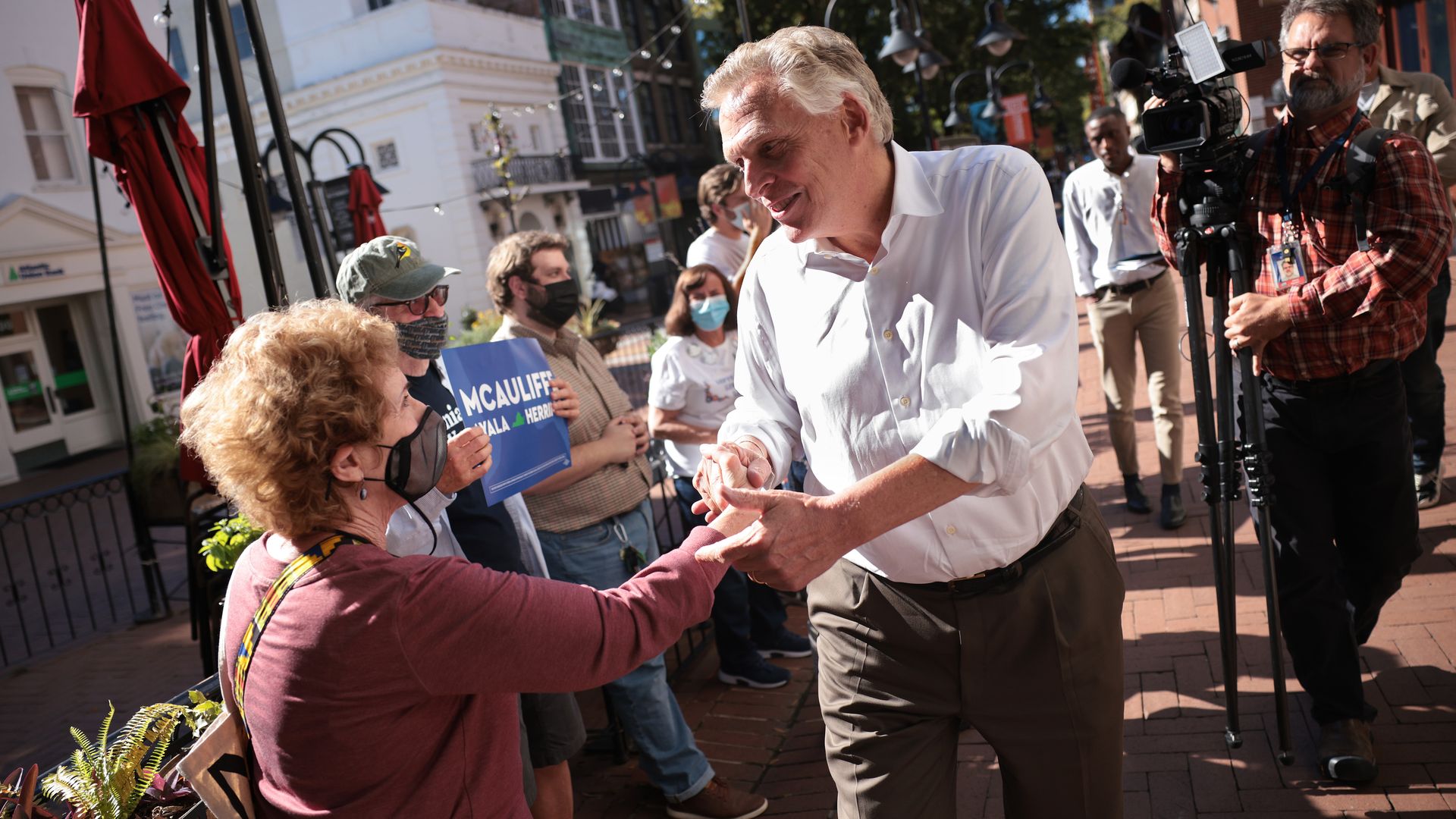 Virginia gubernatorial candidate Terry McAuliffe is seen shaking hands.