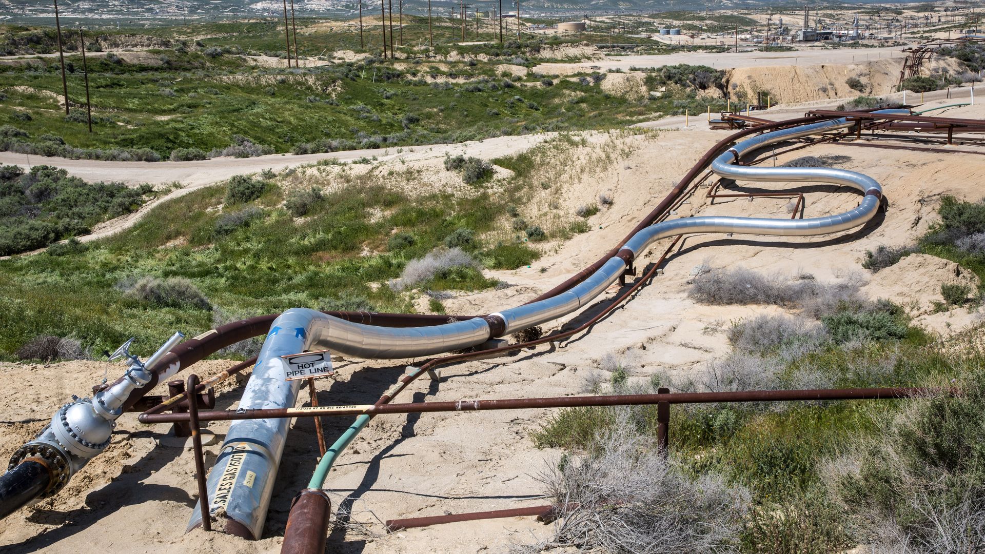 A Chevron oil field along Highway 58 is a hub of activity and appears to be pumping oil and natural gas at near full production on March 28, 2017, near McKittrick, California.