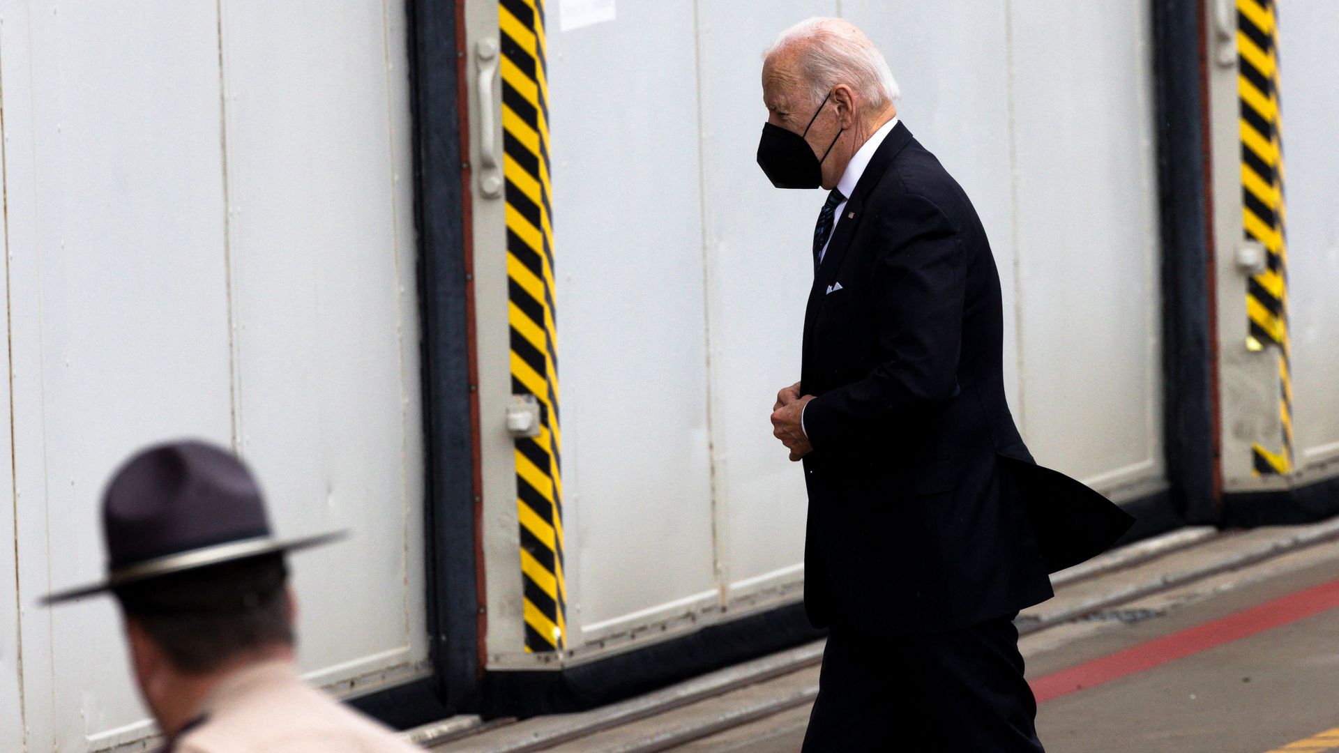 President Joe Biden wears a protective face mask.