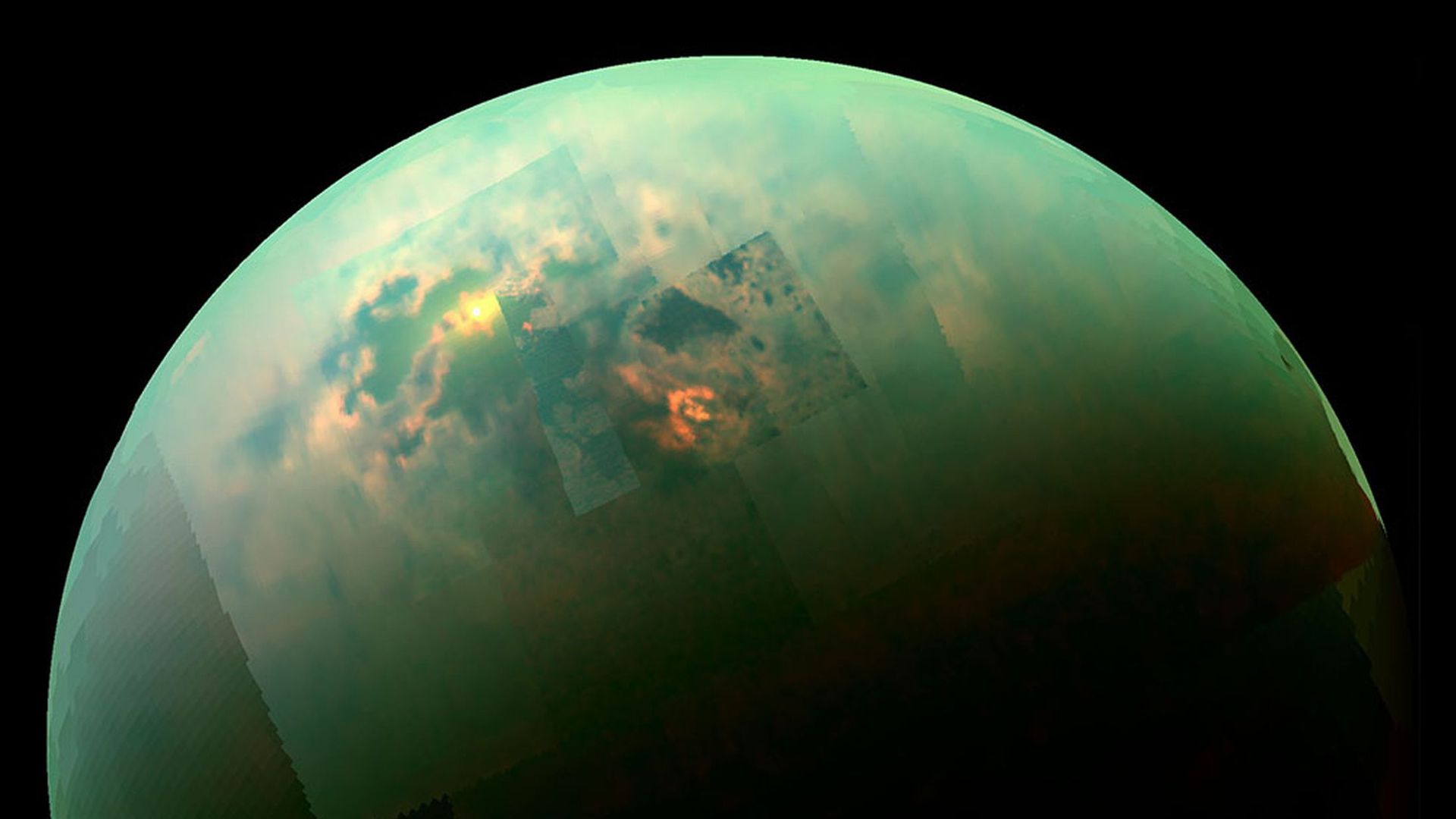 This is an image from NASA of Saturn's moon Titan, which is blueish green. 