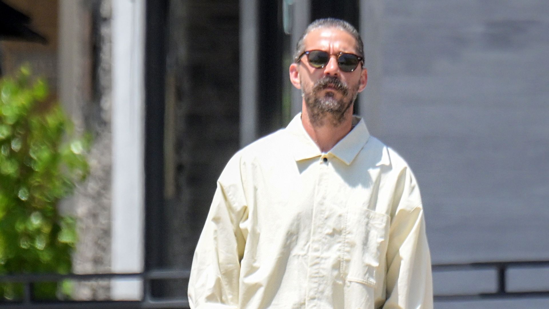 Image shows Shia LaBeouf in a buttondown and jeans.