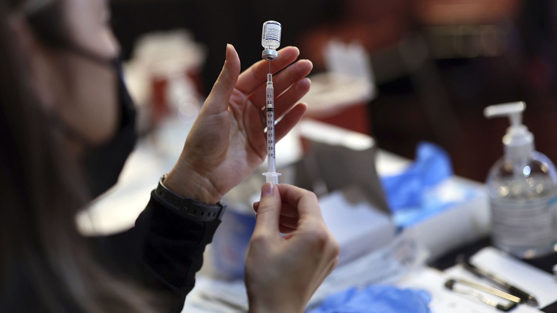 Roseland Community Hospital nurse Mariel Miagusko prepares doses of the Pfizer vaccine on Dec. 30, 2021, during a COVID-19 vaccination event at Josephine's Southern Cooking in Chatham