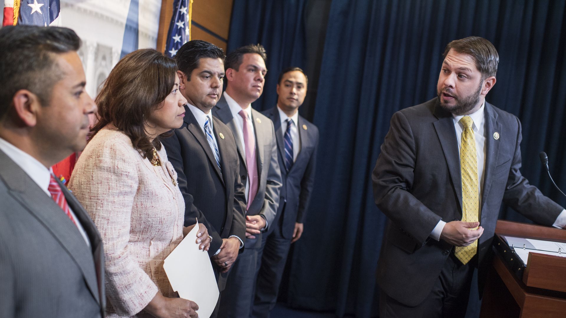 U.S. Rep. Ruben Gallego, D-Ariz, at a podium with other Hispanic congressional members speak on immigration reform.