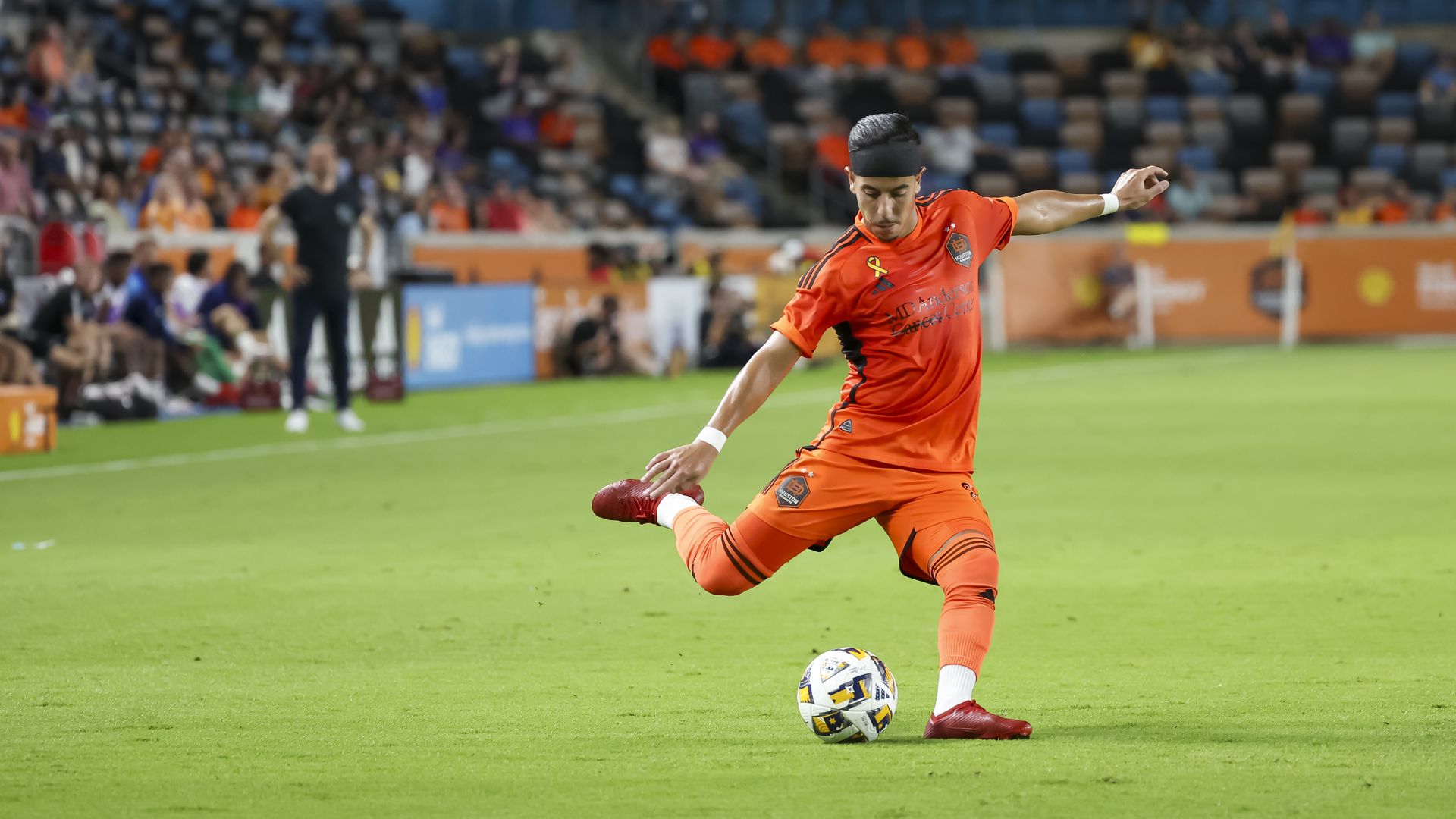 Dynamo midfielder Amine Bassi makes a kick