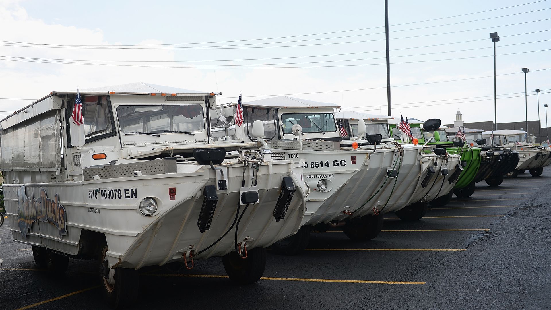 The fleet of the World War II DUKW boats are seen at Ride the Ducks on July 20. Hundreds of mourners stopped by to pay their respects to the victims after a duck boat capsized.