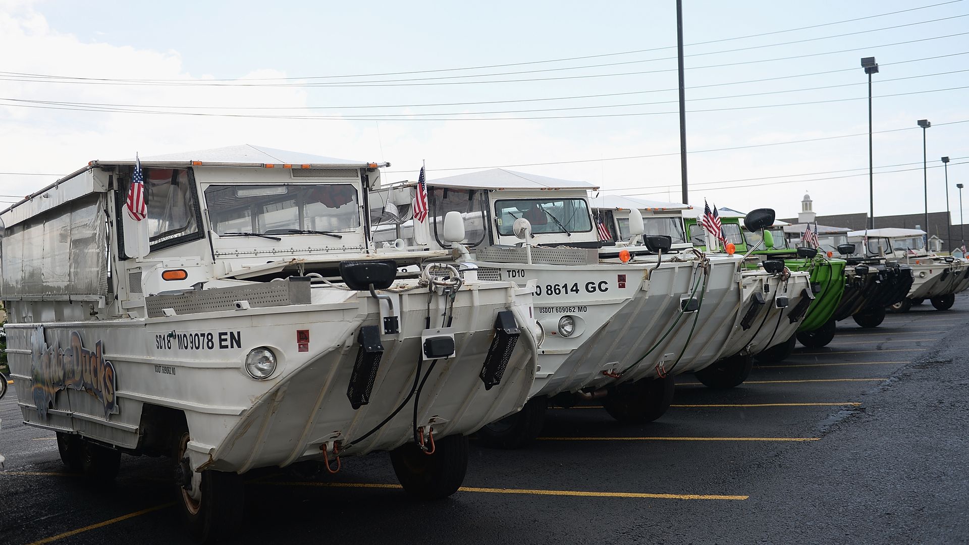 The fleet of the World War II DUKW boats are seen at Ride the Ducks on July 20. Hundreds of mourners stopped by to pay their respects to the victims after a duck boat capsized.