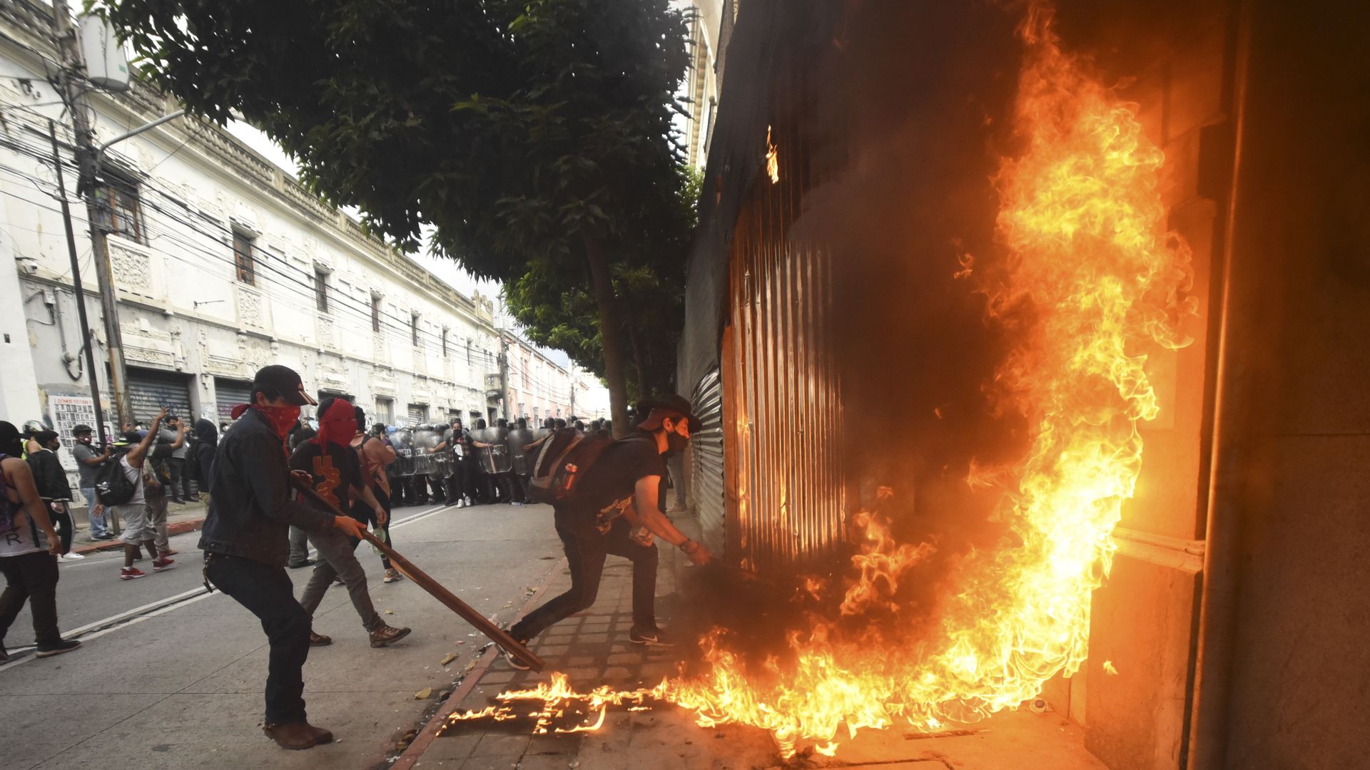 Demonstrators set on fire part of the Congress building during a protest demanding the resignation of Guatemalan President Alejandro Giammattei, in Guatemala City on November 21