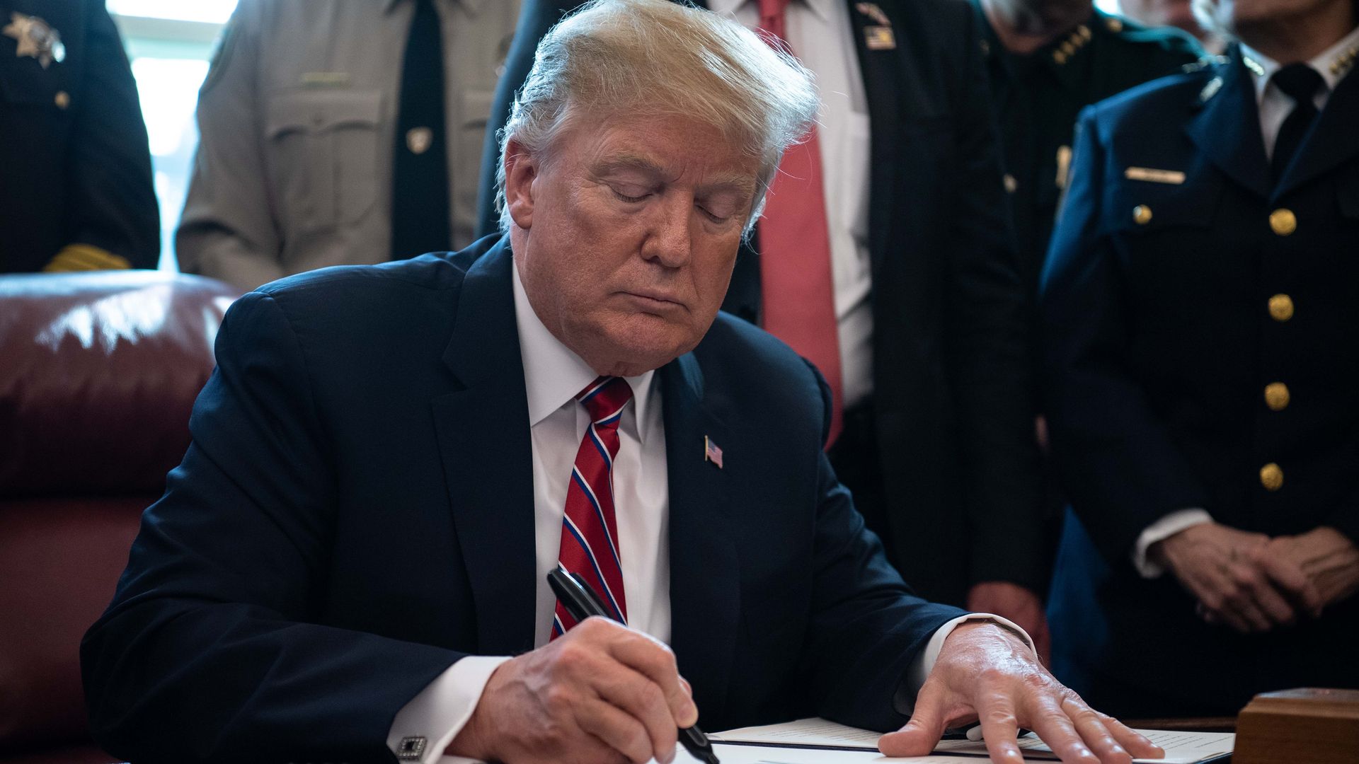 The Trump administration is accused of reversing 25 security clearance denials.