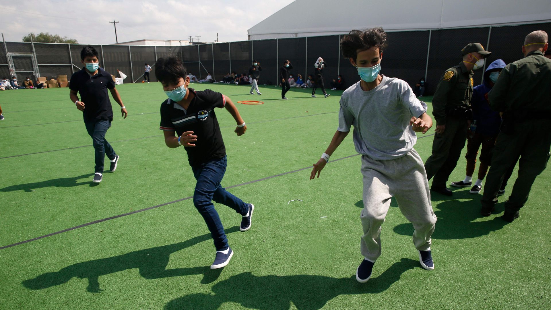 MIgrant minors play soccer at a holding facility in Donna, Texas. 