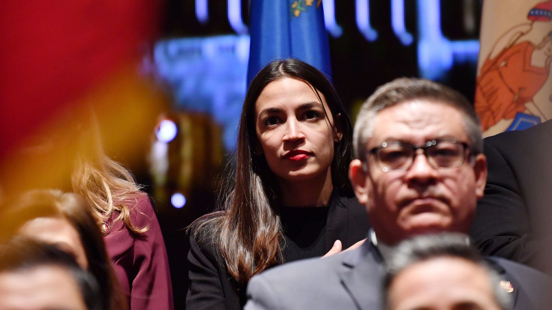 Alexandria Ocasio Cortez sitting