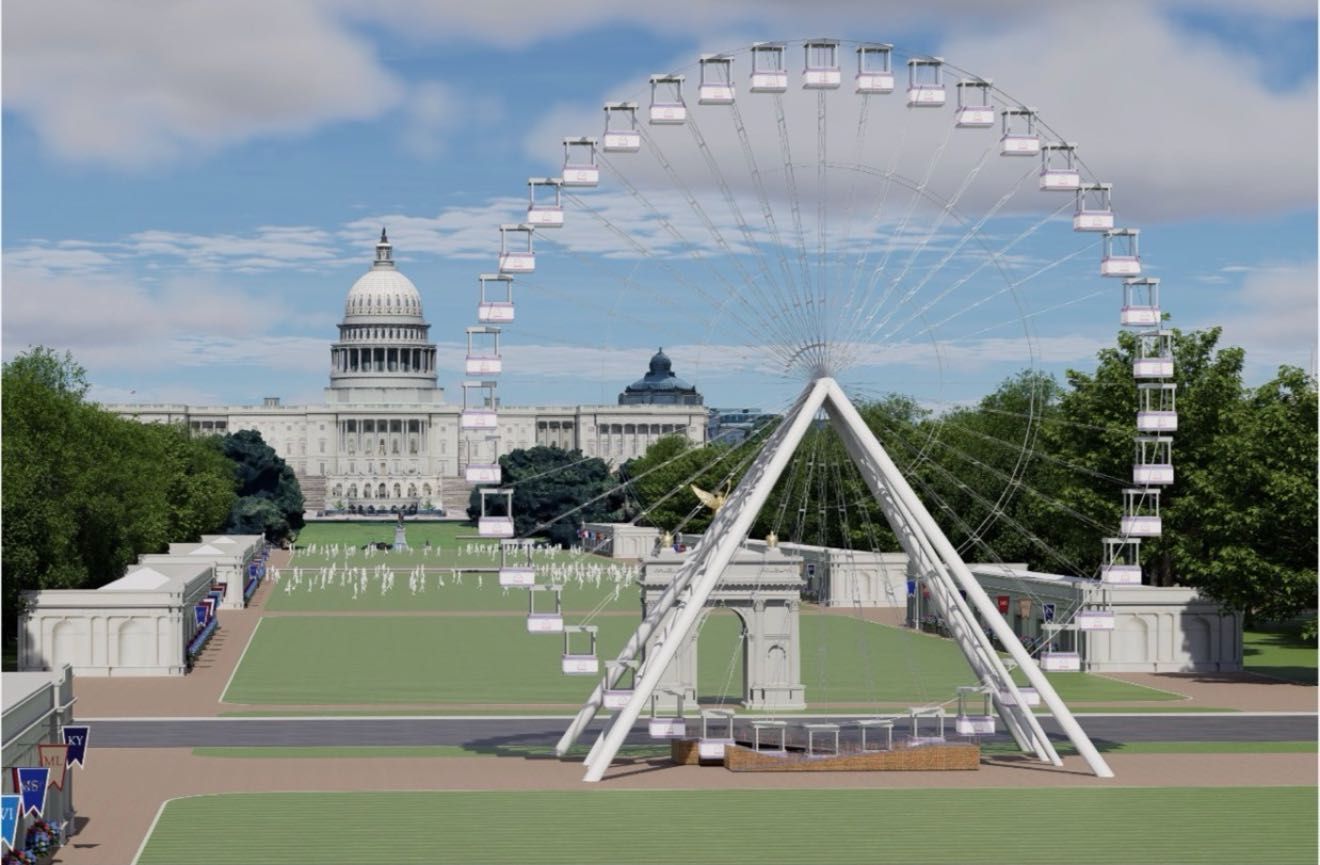 Large white Ferris wheel dominates a park with green lawns and tents; the U.S. Capitol building is visible in the background beneath a blue sky with scattered clouds.