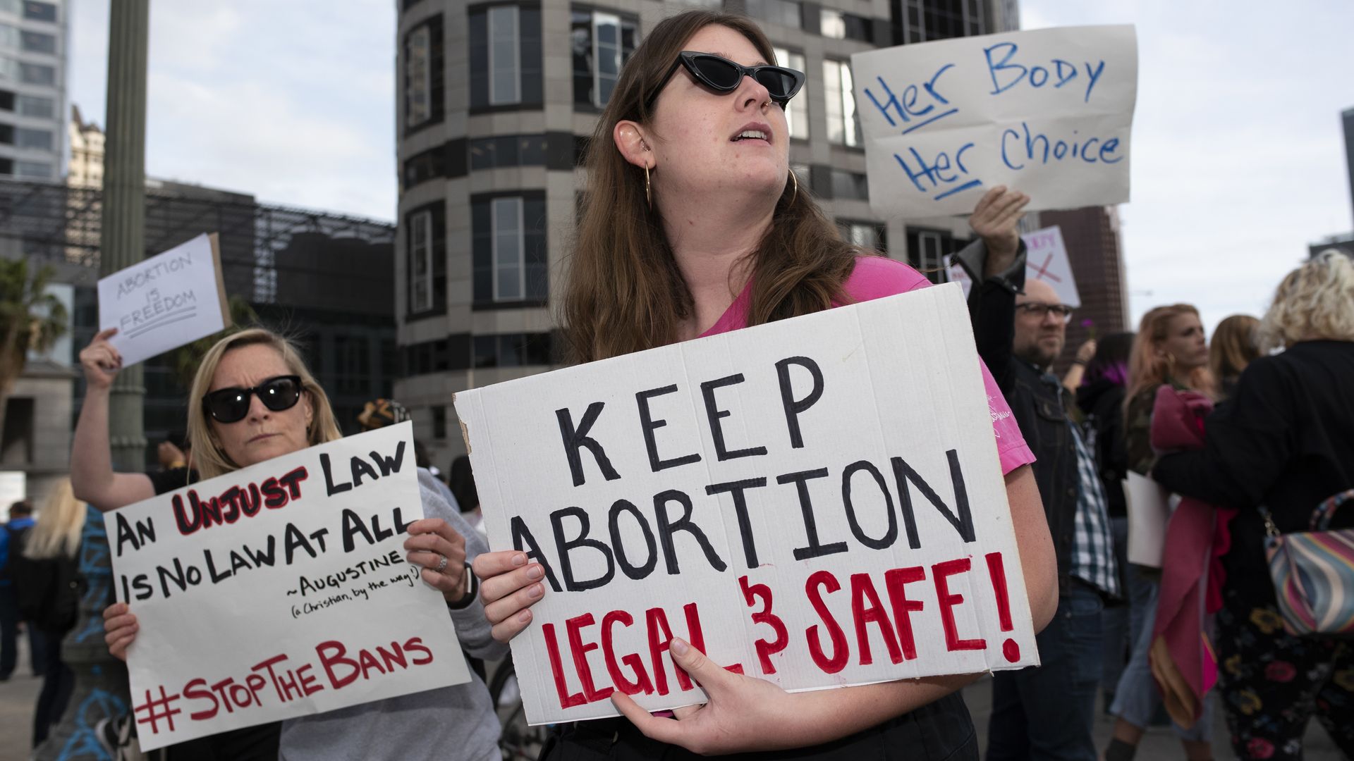 Abortion activists holding signs