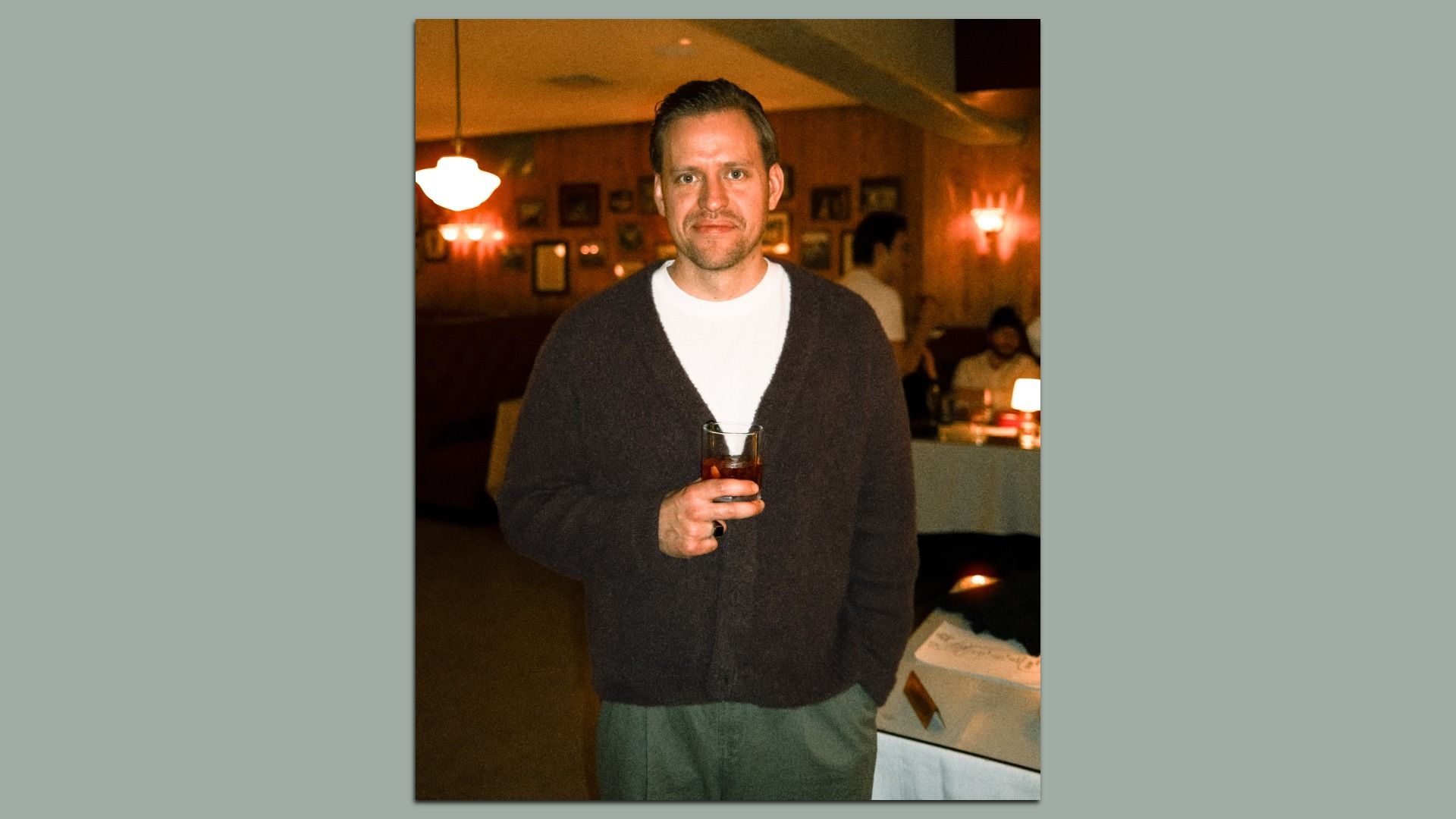 nick tillinghast holding a whisky glass