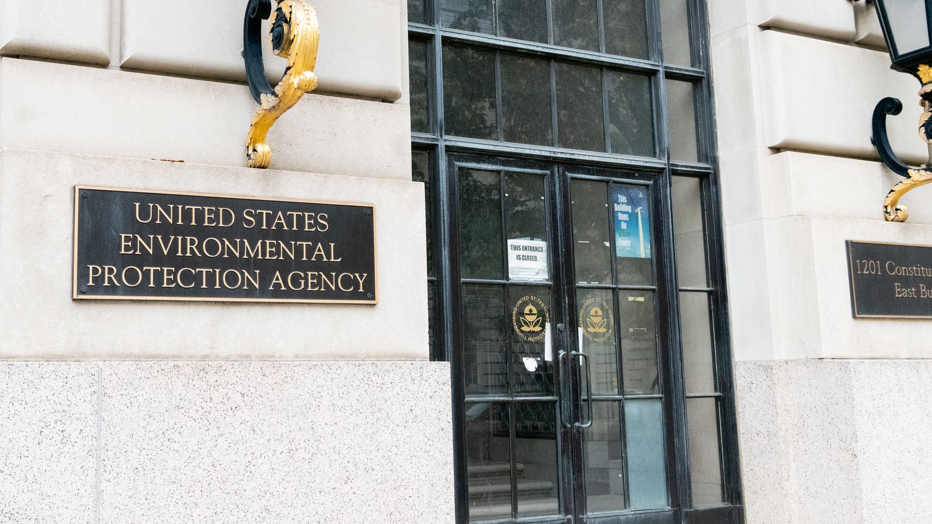 Photo of a set of doors to a building with a sign that says "U.S. Environmental Protection Agency" on the exterior