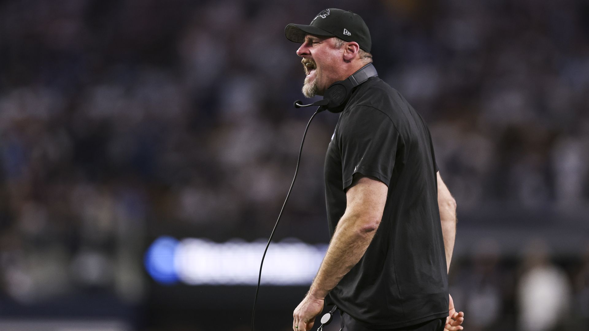 Dan Campbell of the Detroit Lions reacts during an NFL football game against the Dallas Cowboys at AT&T Stadium
