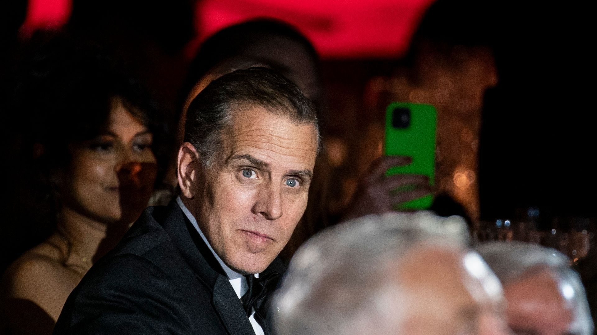 Hunter Biden, dressed in a tuxedo, looks to his right.