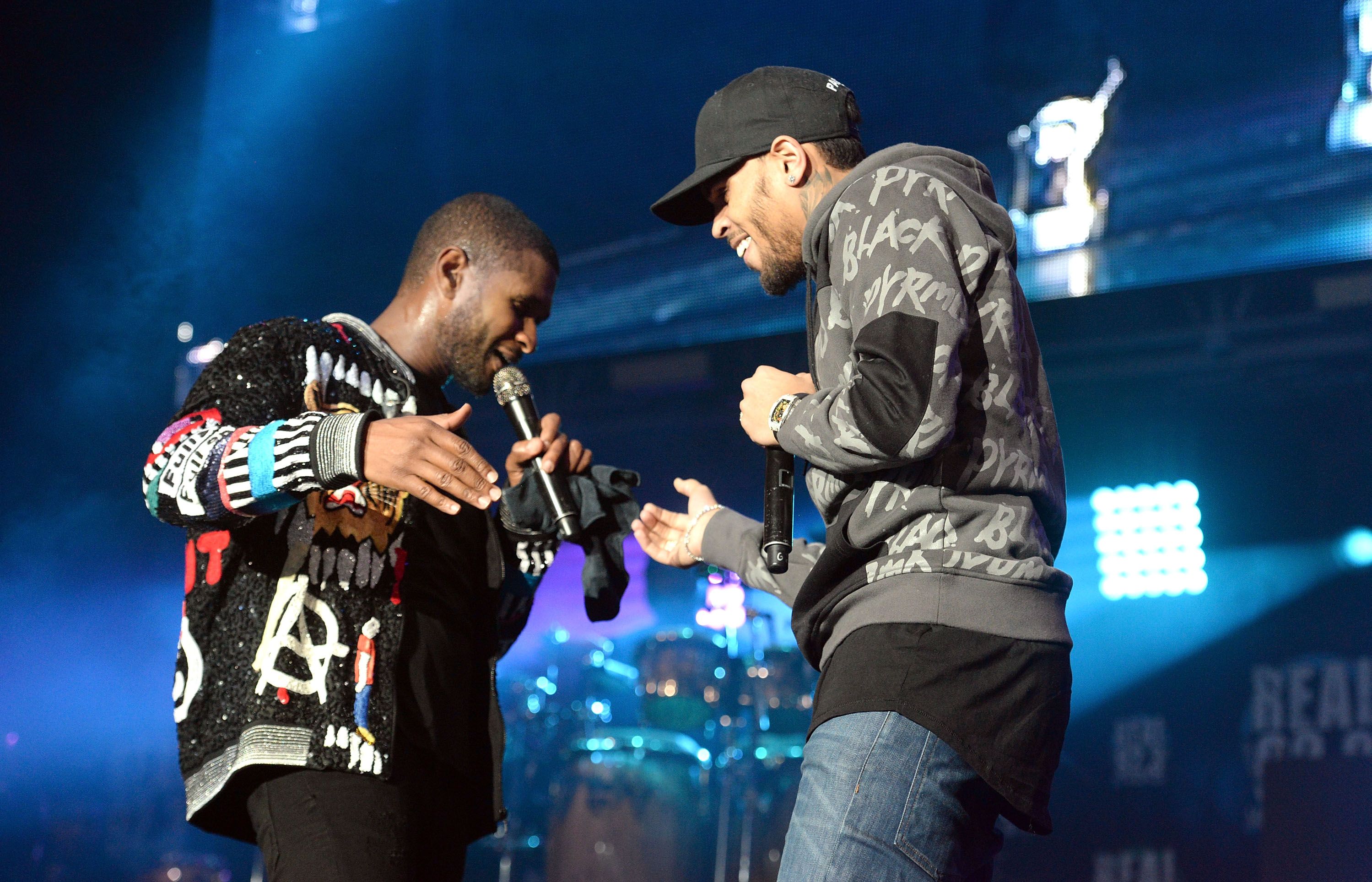 Singers Usher (L) and Chris Brown (R) perform onstage during the 92.3 Real Show at The Forum on November 5, 2016 in Inglewood, California.
