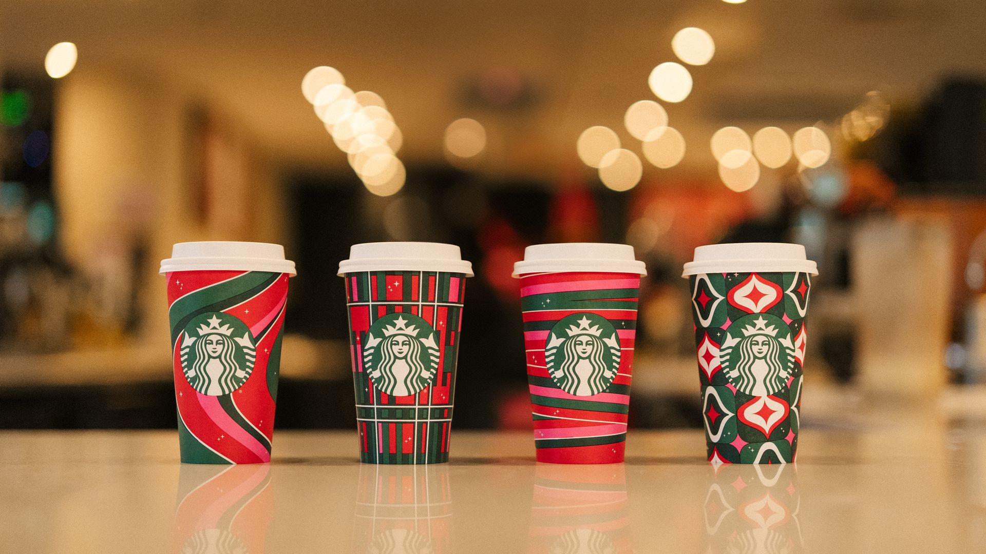 Colorful Starbucks hot beverage cups with red and green the main colors