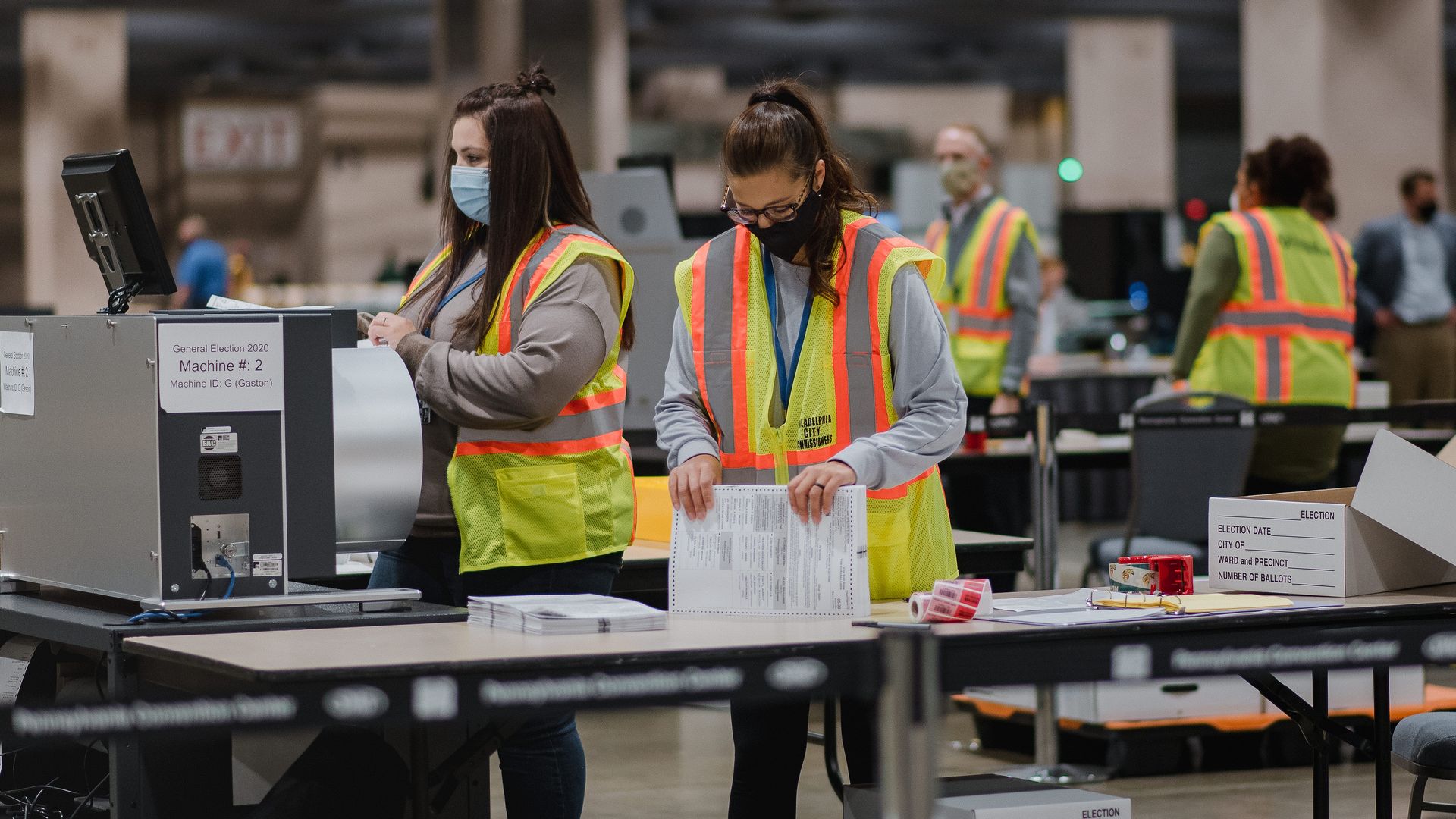 Workers count ballots for the 2020 Presidential election at the Philadelphia Convention Center in Philadelphia, Pennsylvania, U.S., on Tuesday, Nov. 3, 2020
