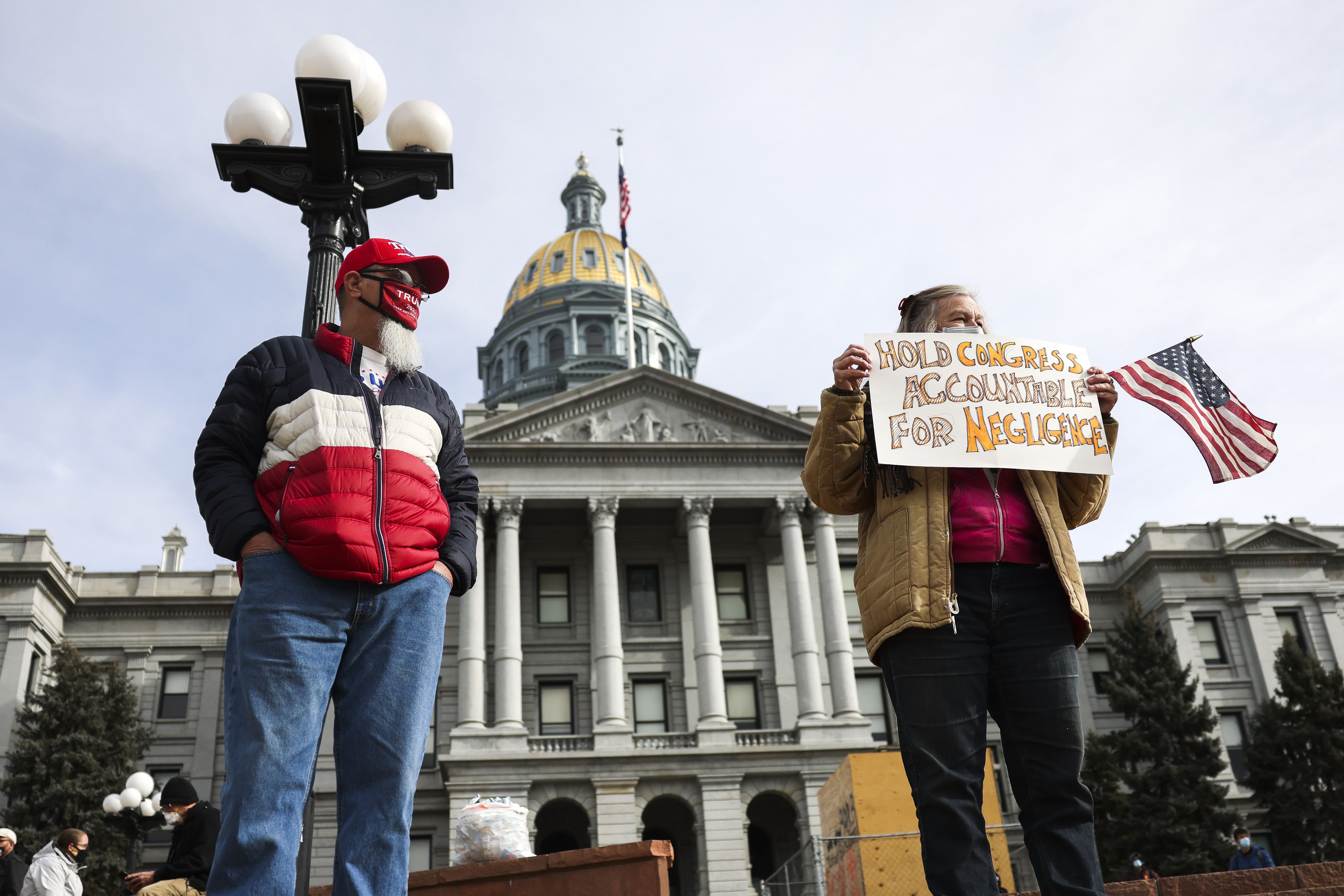 A few people protest the results of the election outside the Colorado State Capitol on January 17