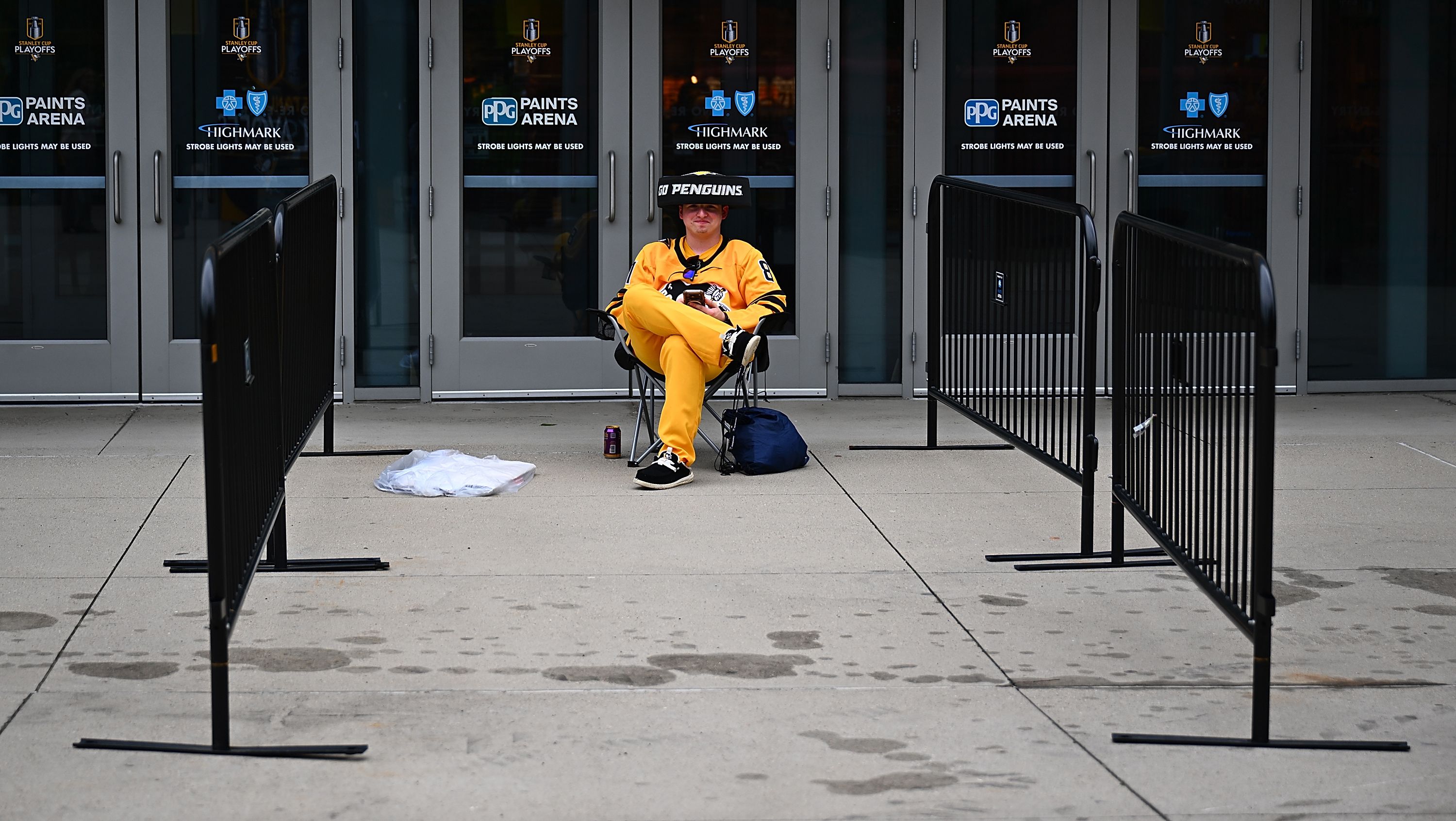 A fan sits outside of the arena before Game One of the First Round of the 2026 Stanley Cup Playoffs between the Philadelphia Flyers and the Pittsburgh Penguins at PPG PAINTS Arena on April 18, 2026 in Pittsburgh, Pennsylvania. (Photo by Justin Berl/Getty Images)