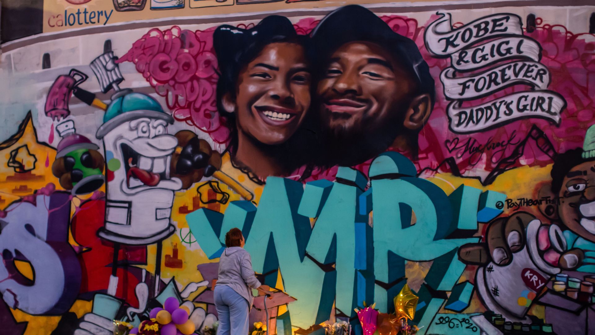 This image displays a memorial graffitied of Kobe and his daughter Gigi 