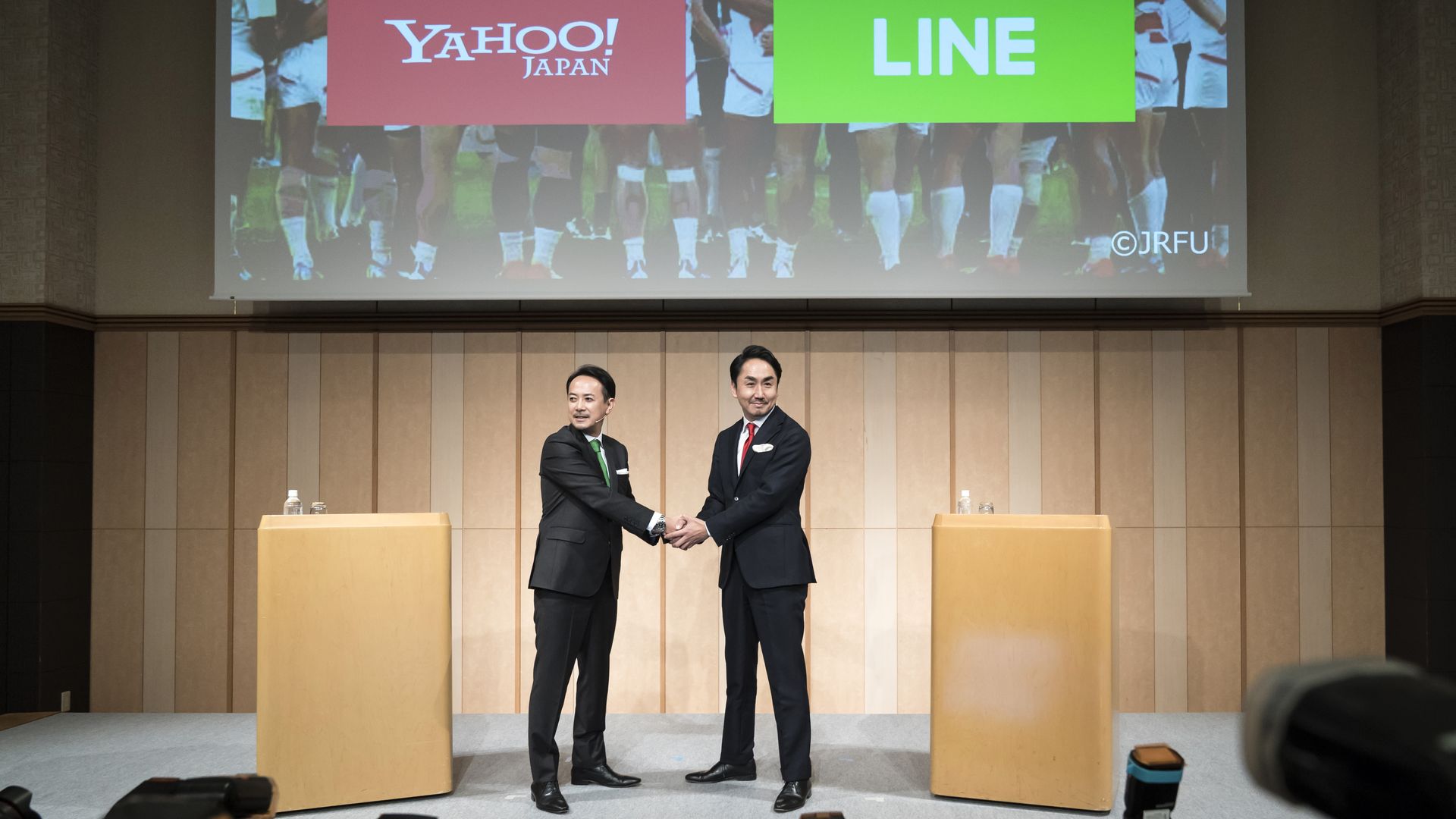 Yahoo Japan and Line Hold Corp. representatives hold a joint press conference on Nov. 18.