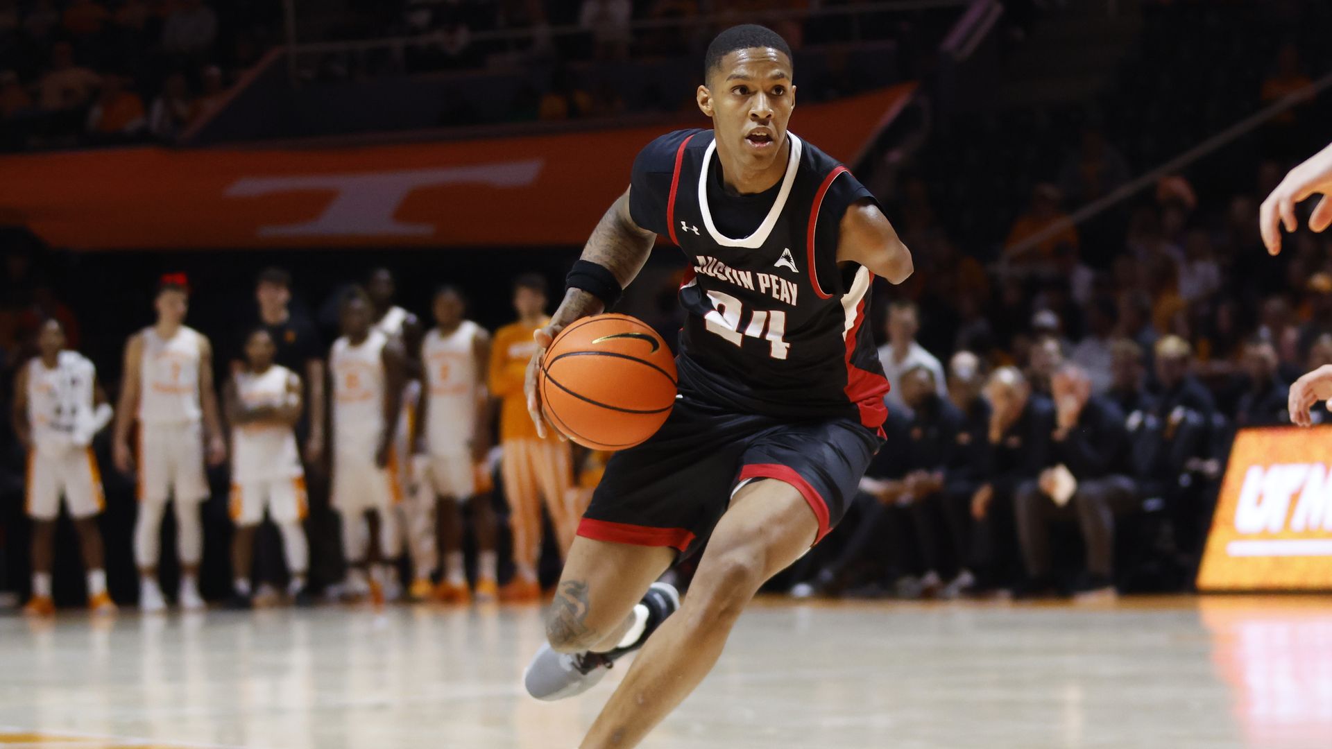 KNOXVILLE, TENNESSEE - NOVEMBER 17: Hansel Enmanuel #24 of the Austin Peay Governors dribbles the ball during the second half of the game between Tennessee and Austin Peay at Thompson-Boling Arena on November 17, 2024 in Knoxville, Tennessee. 