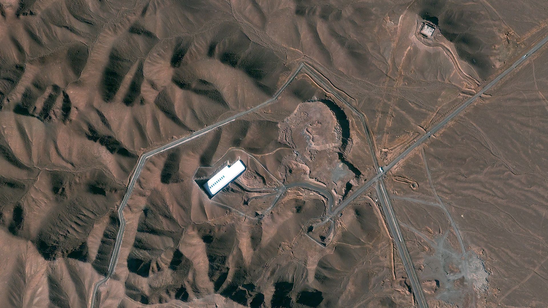 عکس ماهواره‌ای سال ۲۰۱۳ از تاسیسات غنی‌سازی فردو ایران. عکس: DigitalGlobe از طریق گتی‌ایمیجز (Getty Images)
