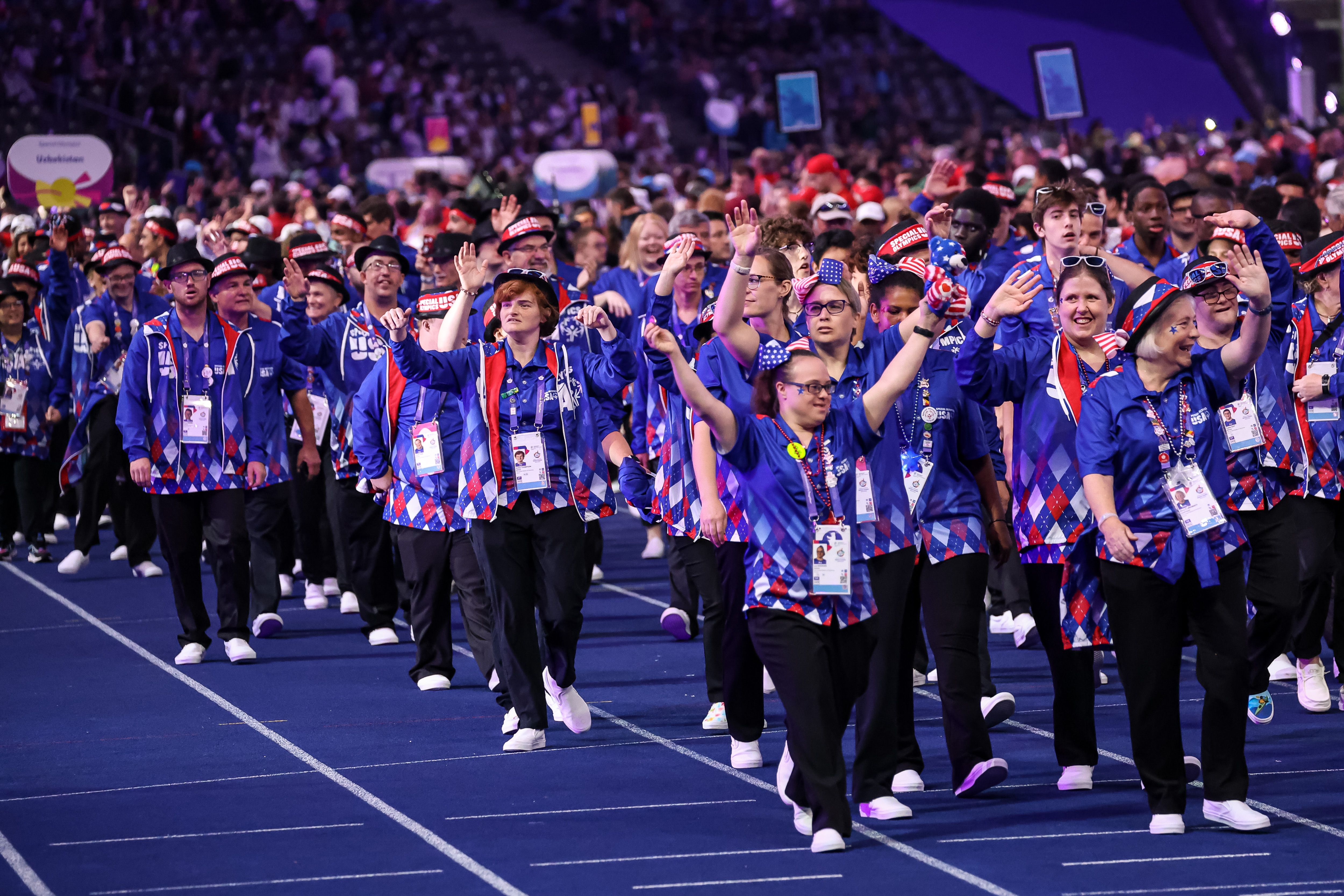 Athletes from the USA enter the Olympic Stadium. 